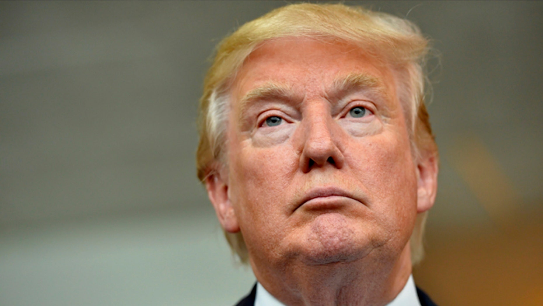 Republican presidential candidate Donald Trump listens during a news conference after speaking at the TD Convention Center, Thursday, Aug. 27, 2015, in Greenville, S.C. (AP Photo/Richard Shiro)