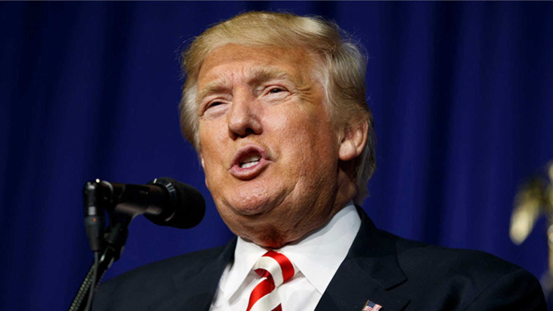 FILE - In this Sept. 1, 2016 file photo, Republican presidential candidate Donald Trump speaks during a campaign rally in Wilmington, Ohio. The 2016 presidential election features two candidates with dramatically different approaches on immigration. In tone, Republican Donald Trump often highlights violent crimes perpetrated by immigrants in the country illegally with aggressive rhetoric that seizes on nationalism if not xenophobia. Democrat Hillary Clinton features a softer approach that embraces diversity and the value of keeping immigrant families together, even as her critics accuse her of promoting ââ¬Åopen borders.ââ¬Â (AP Photo/Evan Vucci, File)