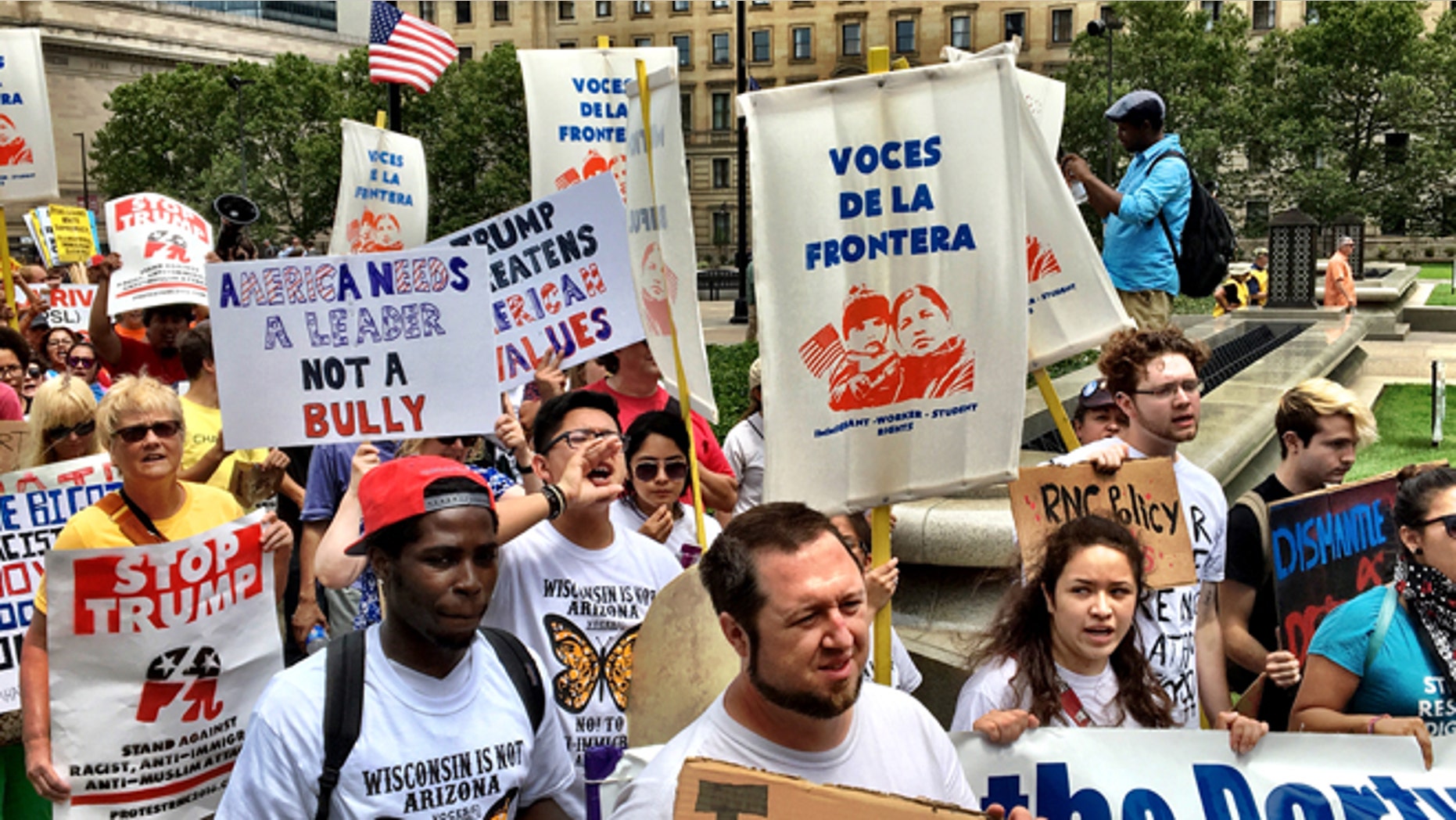 Immigration activists holding up signs during peaceful protests at the Republican National Convention in Cleveland. (Photo: Andrew O'Reilly/Fox News Latino)