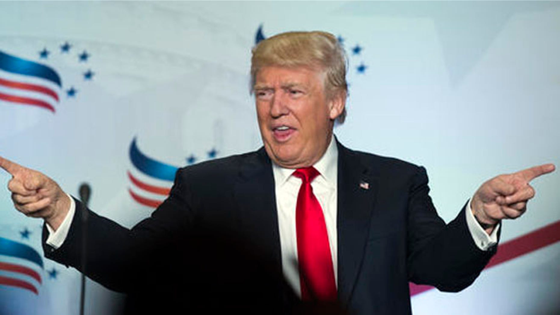 Republican presidential candidate Donald Trump points to the audience after addressing the Faith and Freedom Coalition's Road to Majority Conference in Washington, Friday, June 10, 2016. (AP Photo/Cliff Owen)