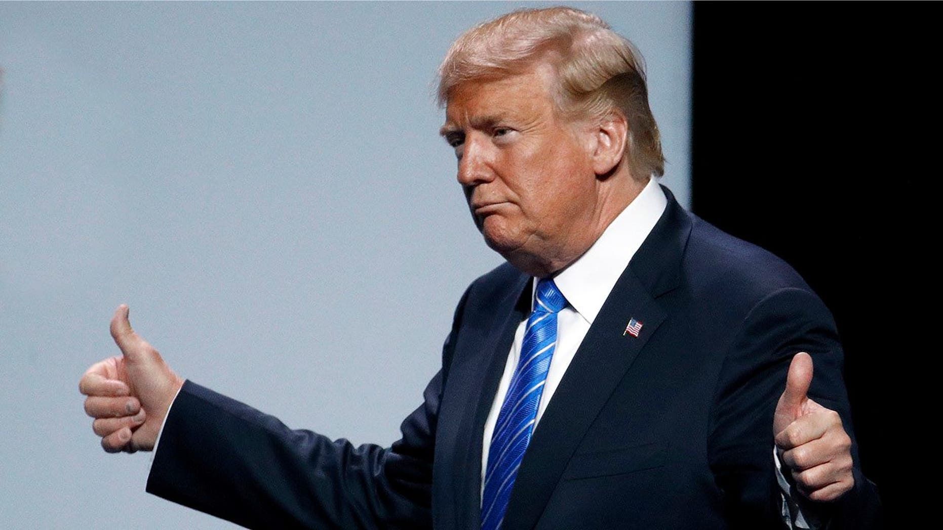 President Donald Trump acknowledges the crowd as he addresses the Veteran's of Foreign Wars national convention Tuesday, July 24, 2018, in Kansas City, Mo. (AP Photo/Charlie Riedel)