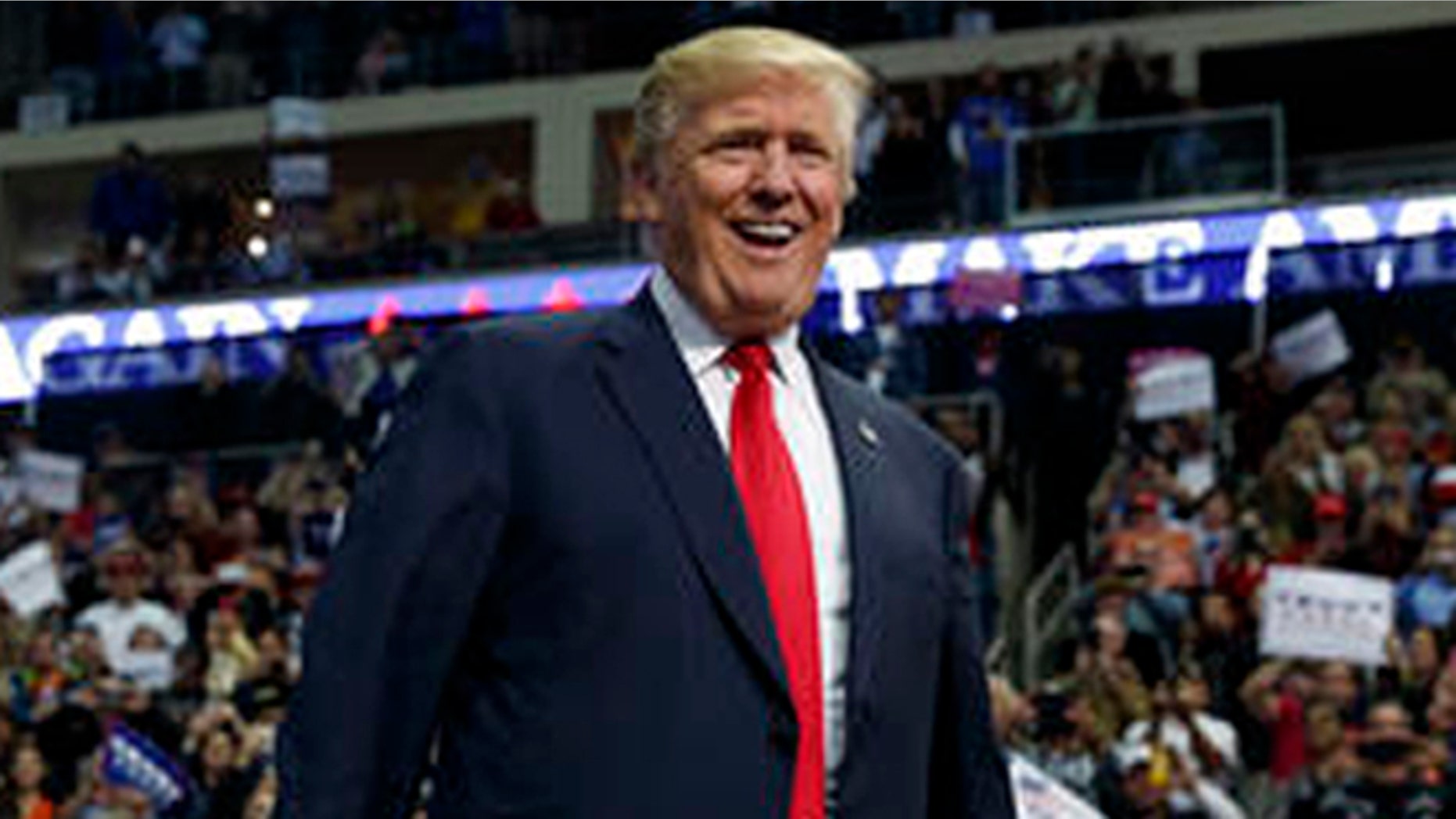 Republican presidential candidate Donald Trump smiles as he arrives to speak to a campaign rally, Friday, Nov. 4, 2016, in Hershey, Pa. (AP Photo/ Evan Vucci)