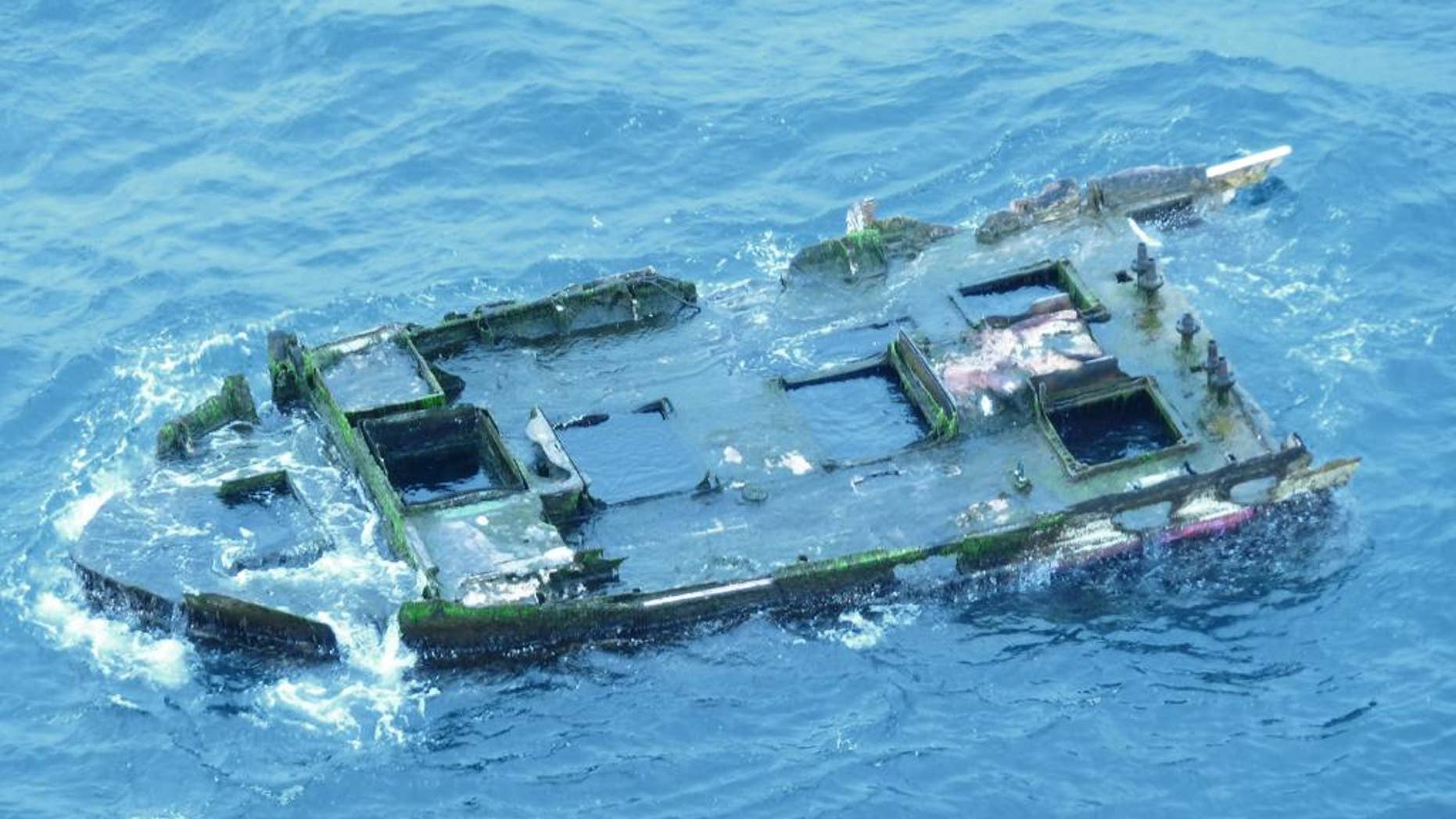 This image provide by Oregon Parks and Recreation Dept. shows a chunk of a fiberglass boat 25-30' long that was spotted off the Oregon shore west of Ona Beach in Lincoln County around 9:30 a.m. April 9, 2015. The debris appears to be half to two-thirds of a larger vessel, possibly damaged and set adrift during the earthquake and tsunami that struck the east coast of Japan in 2011. (AP Photo/Oregon Parks and Recreation Department)