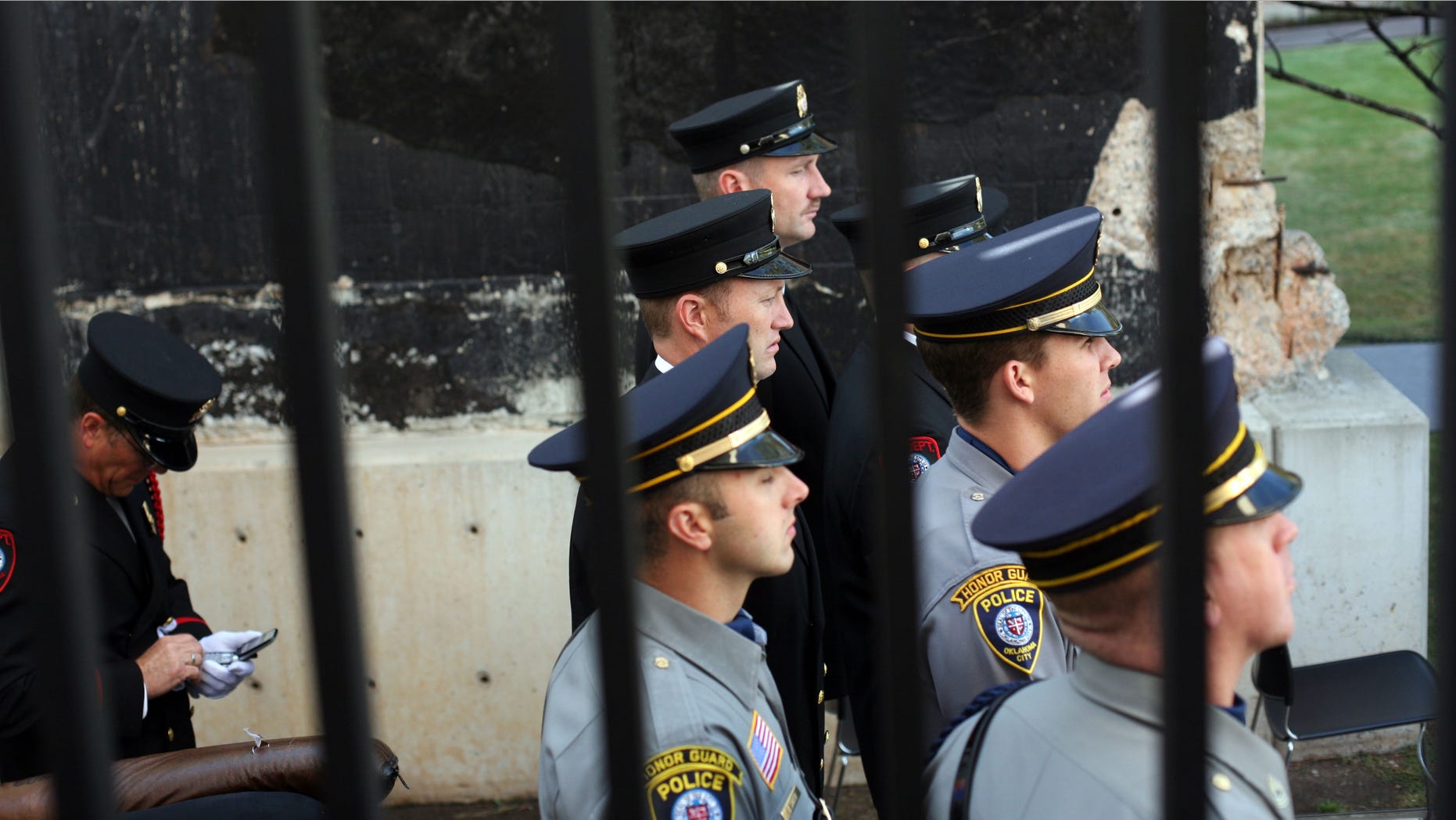 OKLAHOMA CITY, OK - APRIL 19: Oklahoma City police and fire personnel listen to a ceremony remembering the 168 killed in the 1995 bombing of the federal building April 19, 2007 in Oklahoma City, Oklahoma. Republican presidential hopeful Rudy Giuliani spoke at the annual rememberance, which this year comes days after a deranged gunman shot and killed 32 people on the campus of Virginia Tech before turning the gun on himself. (Photo by Briah Harkin/Getty Images)