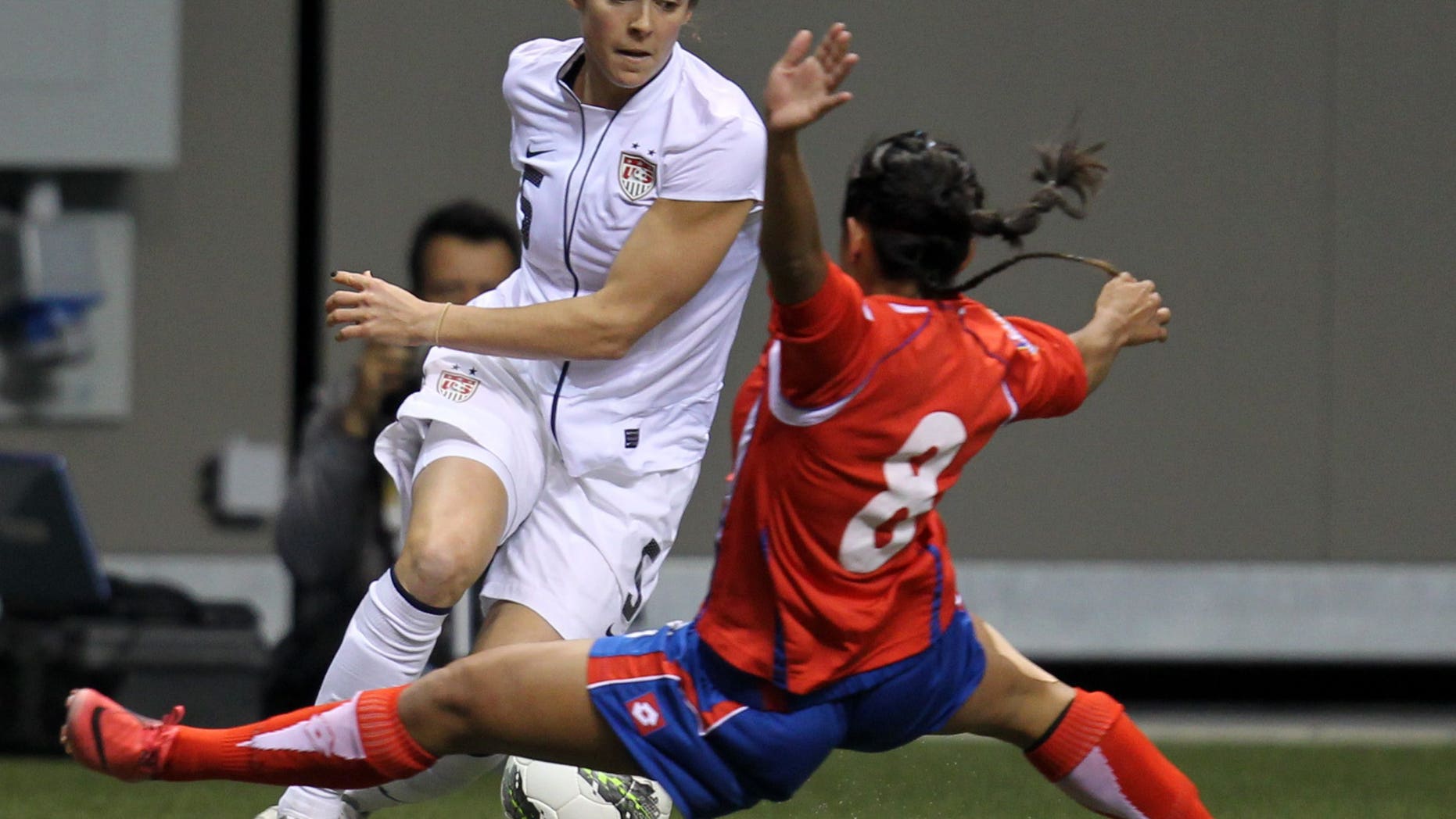 Jan 27, 2012: In this file photo, United States' Kelly O'Hara (5) fights for control of the ball with Costa Rica's Daniela Cruz (8) during the first half of CONCACAF women's Olympic qualifying soccer game action at B.C. Place in Vancouver, British Columbia.
