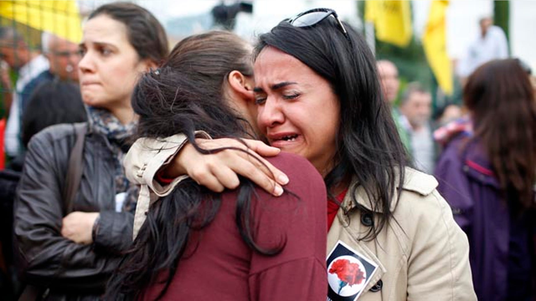 Oct. 12, 2015: Mourners cry during the funeral of Uygar Coskun, 32, killed in Saturday's bombing attacks, during his funeral, in Ankara, Turkey. (AP Photo/Emrah Gurel)