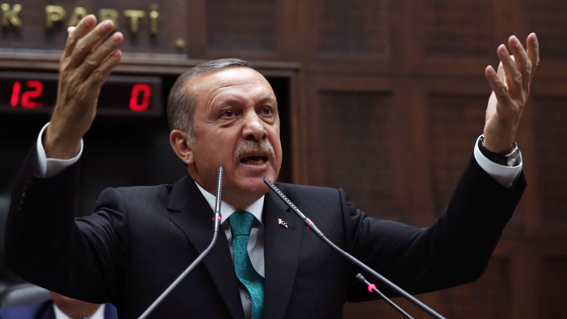 Jan. 14, 2014: In this file photo, Turkey's Prime Minister Recep Tayyip Erdogan addresses his supporters at the parliament in Ankara, Turkey.