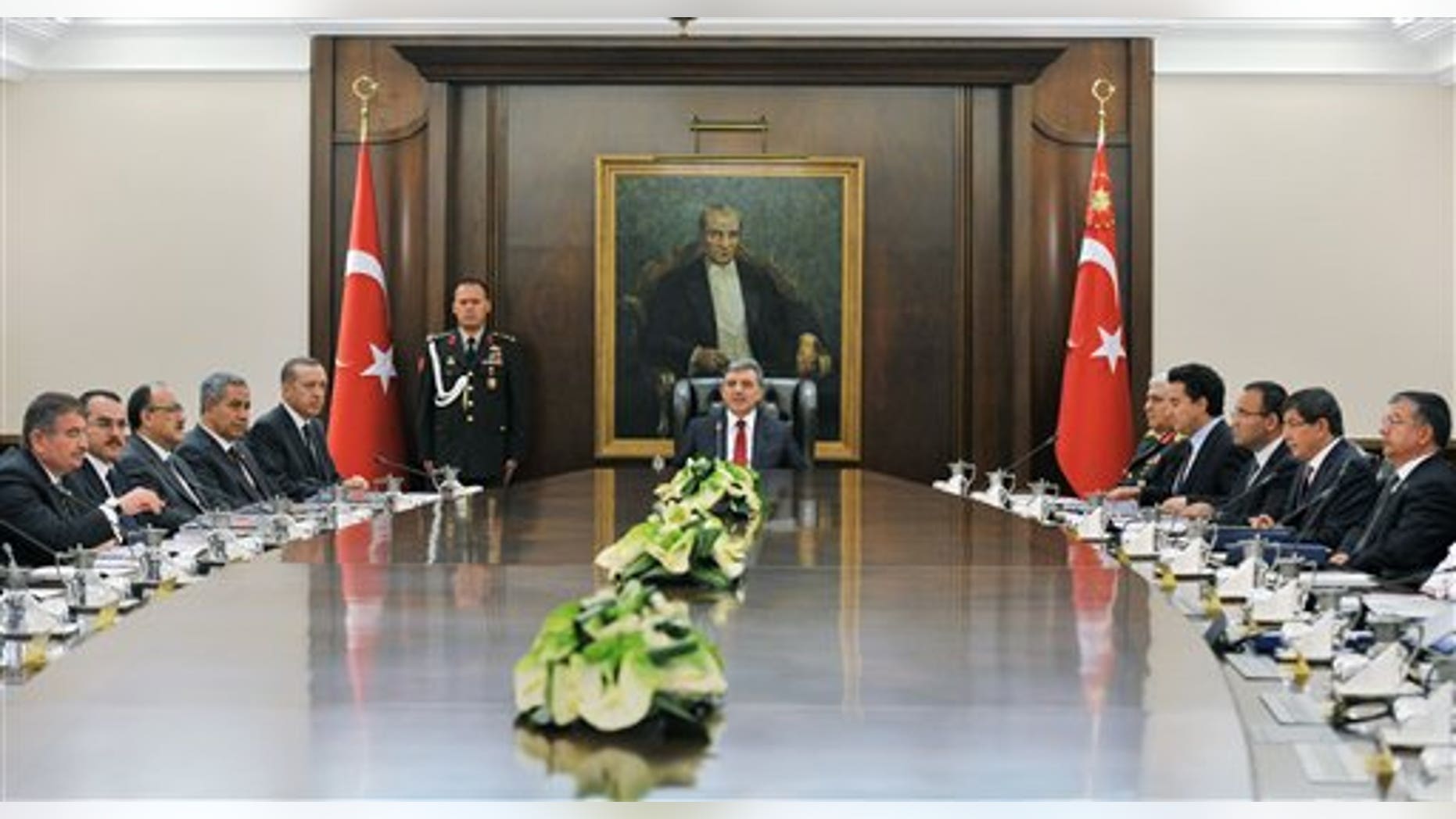 August 18: President Abdullah Gul, center, chairs a National Security Council meeting with Prime Minister Recep Tayyip Erdogan, 5th from left, ministers and top military commanders, two days after Kurdish rebels killed 8 Turkish soldiers at the Turkey-Iraq border, at the Presidential Palace in Ankara, Turkey.