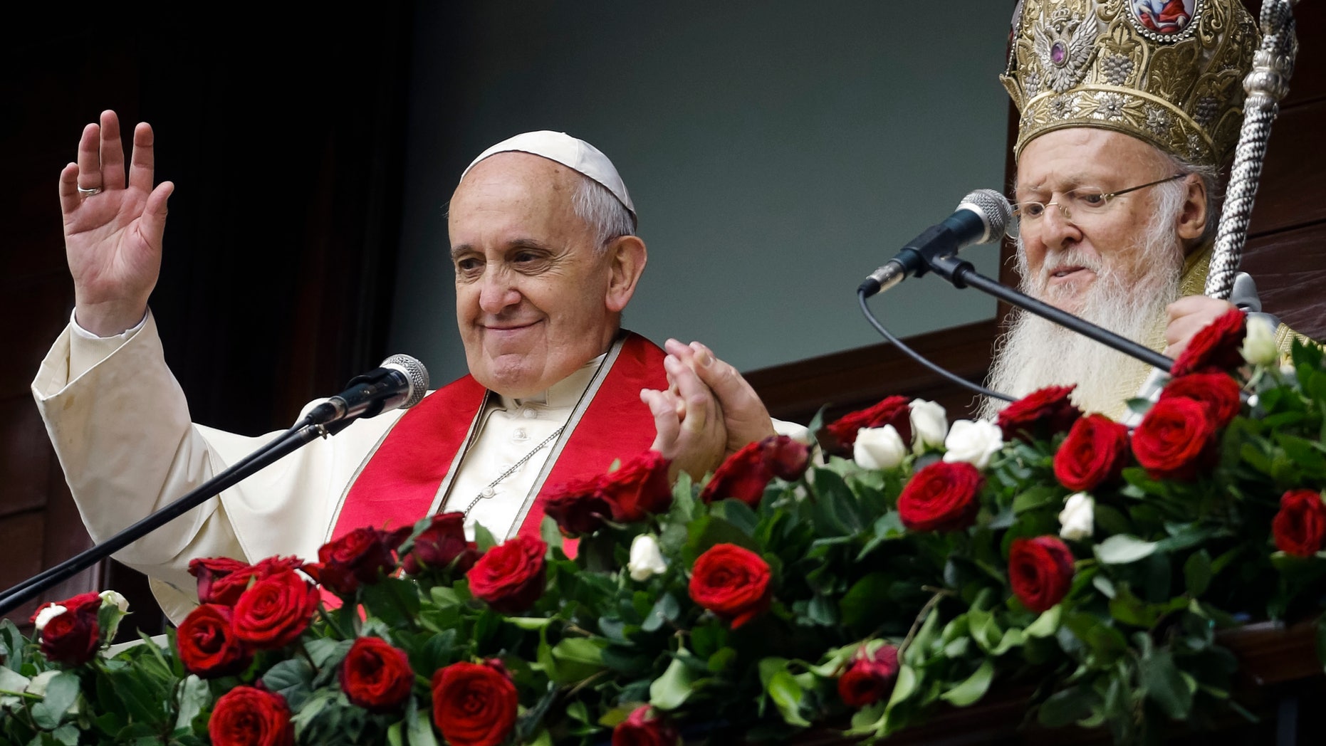 Pope Francis and Ecumenical Patriarch Bartholomew I bless the faithful in Istanbul, Sunday, Nov. 30, 2014.
