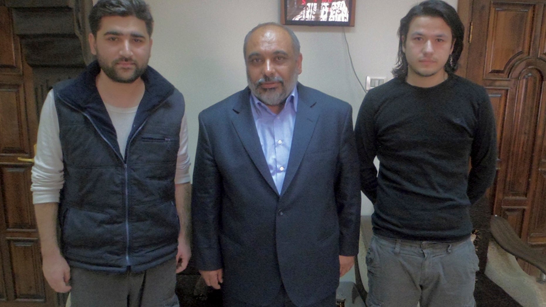 May 5, 2012: - In this file photo provided by pro-Islamic aid group known by its Turkish acronym IHH, showing Turkish journalists Adem Ozkose, left, and Hamit Coskun, right, with the IHH Chairman Bulent Yildirim, centre, in Damascus, Syria.