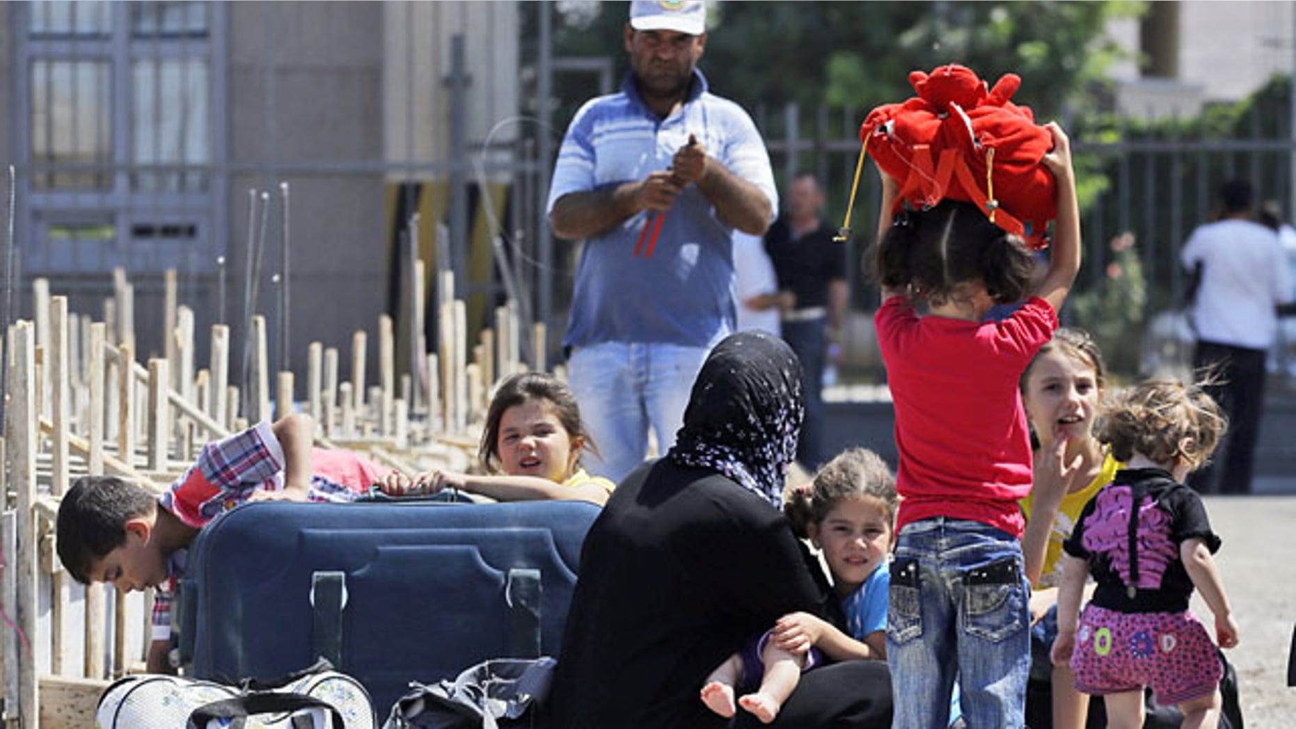 September 2, 2013: Syrian refugees arrive at the Turkish Cilvegozu gate border.