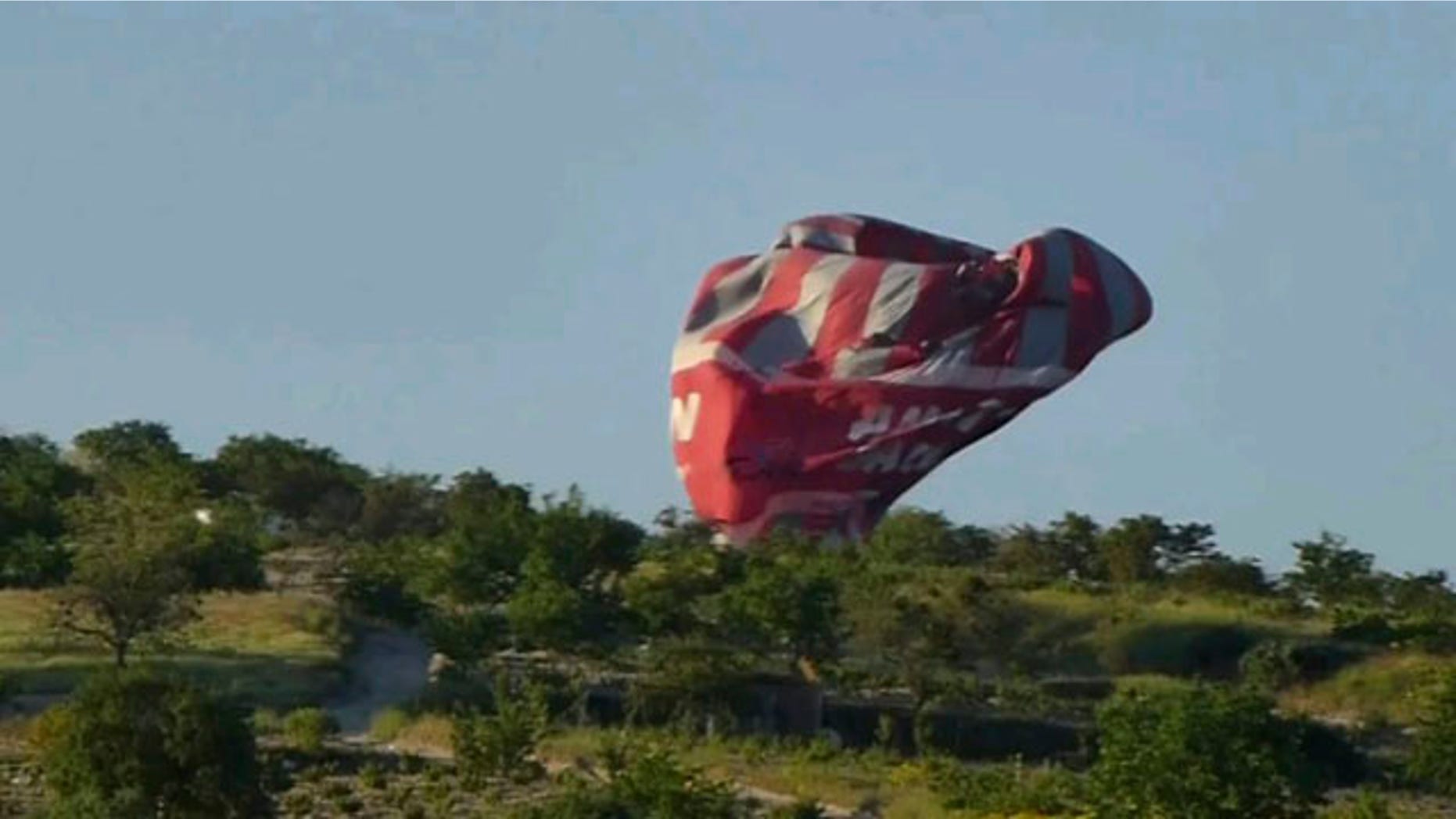 May 20 2013: This image from video provided by E. Wayne Ross shows an Anatolian Balloons Company hot air balloon crashing near Göreme National Park and the Rock Sites of Cappadocia in central Turkey.