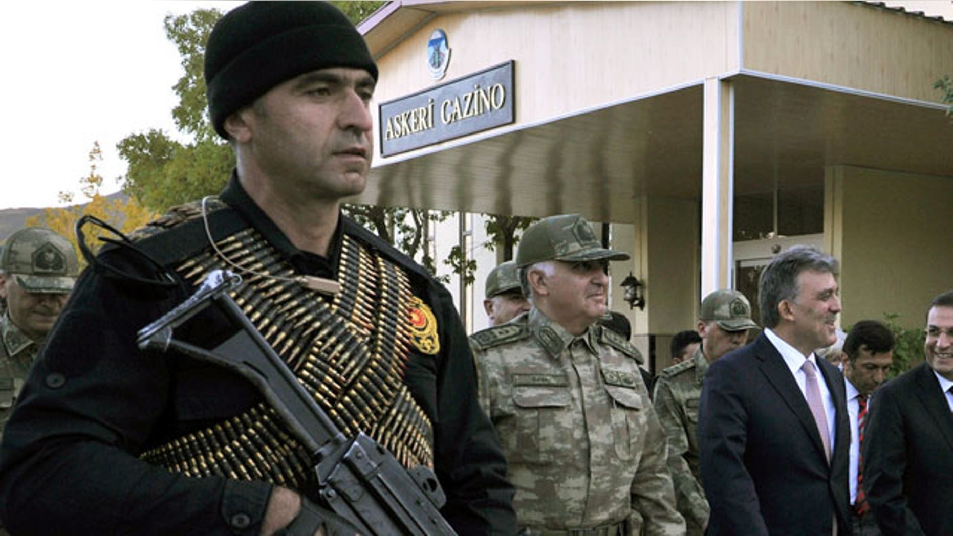 Oct. 14, 2011: Turkish President Abdullah Gul, right, and Chief of Staff Gen. Necdet Ozel, center, walk in Hakkari, Turkey as they visit Turkish troops at the border with Iraq.