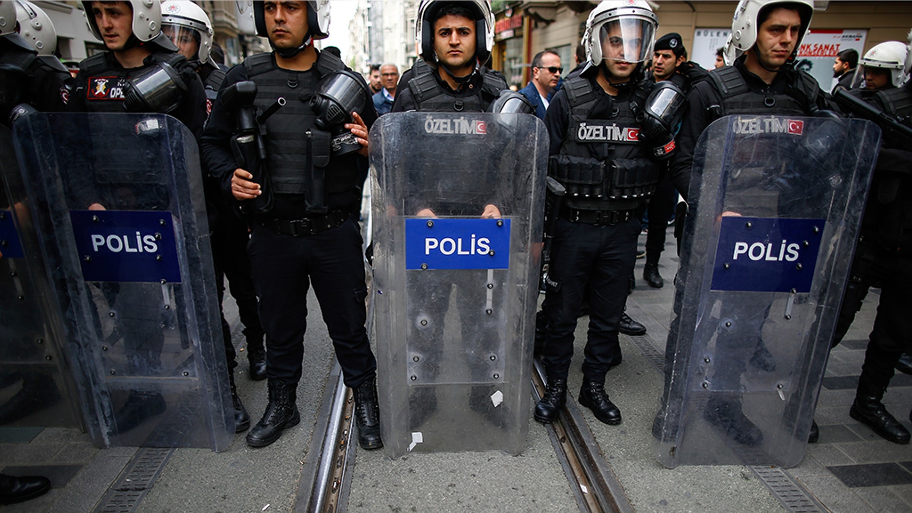 Turkey's police officers looking on as supporters of Turkey's main opposition Republican People's Party, CHP, gather to protest near central Istanbul's Taksim Square.