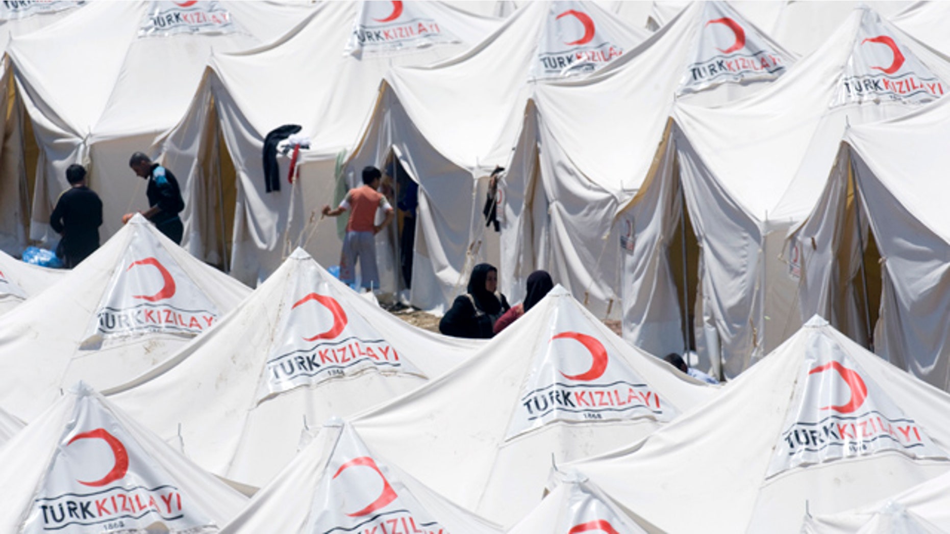 June 19: Syrian refugees are seen in a newly opened refugee camp in Yayladagi, Turkey.