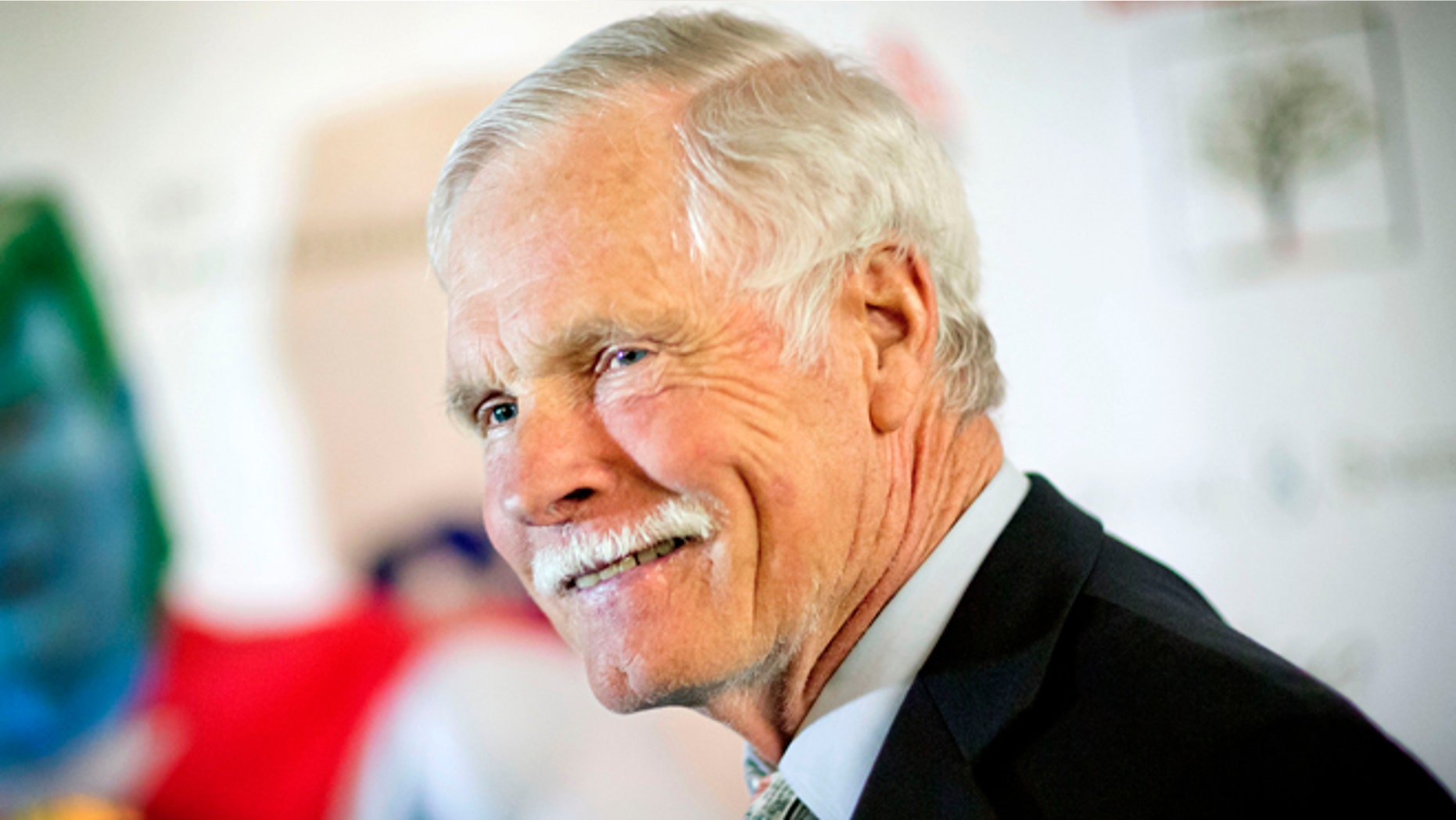 FILE - In this Friday, Dec. 6, 2013 file photo, American media mogul Ted Turner is photographed on the red carpet at the Captain Planet Foundation benefit gala in Atlanta. Turner Enterprises spokesman Phillip Evans in Atlanta said the CNN founder was hospitalized in South America and that "no further details will be provided." CNN's news desk, tweeted that Turner was "under observation" Friday, March 7, 2014, at a hospital in Buenos Aires. (AP Photo/David Goldman, File)