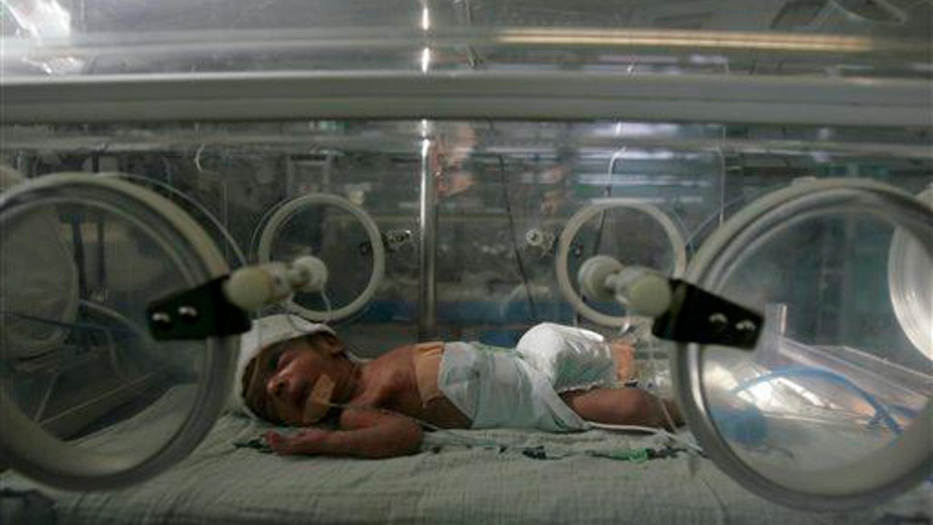 A stock photo of a baby in an incubator; the girls in this story were swapped in 1994 after sharing the same incubator.