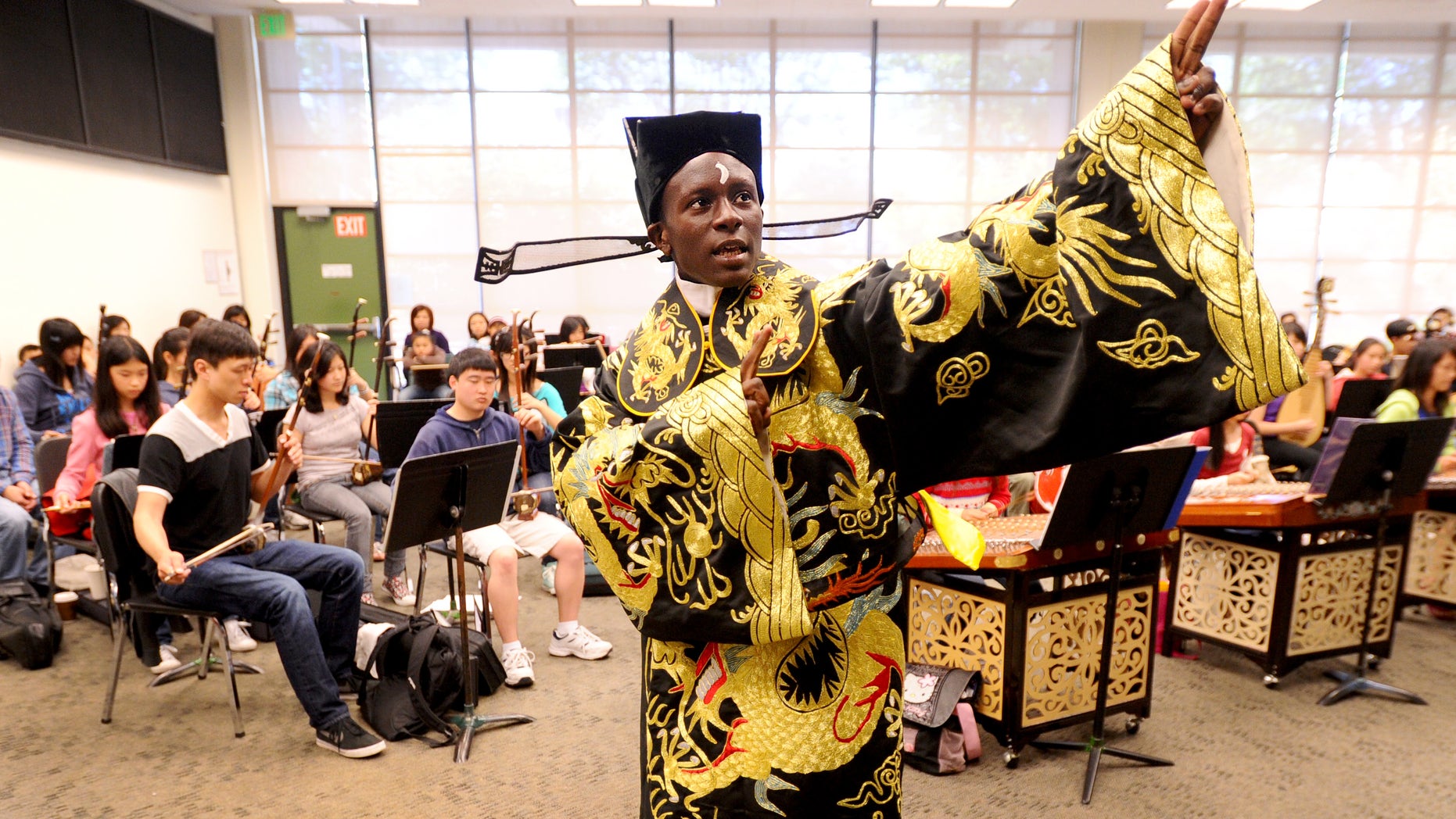 June 11: Tyler Thompson rehearses with the Great Wall Youth Orchestra in Oakland, California. The 15-year-old Oakland native, who sings traditional Chinese opera in Mandarin, plans to perform in China this summer.
