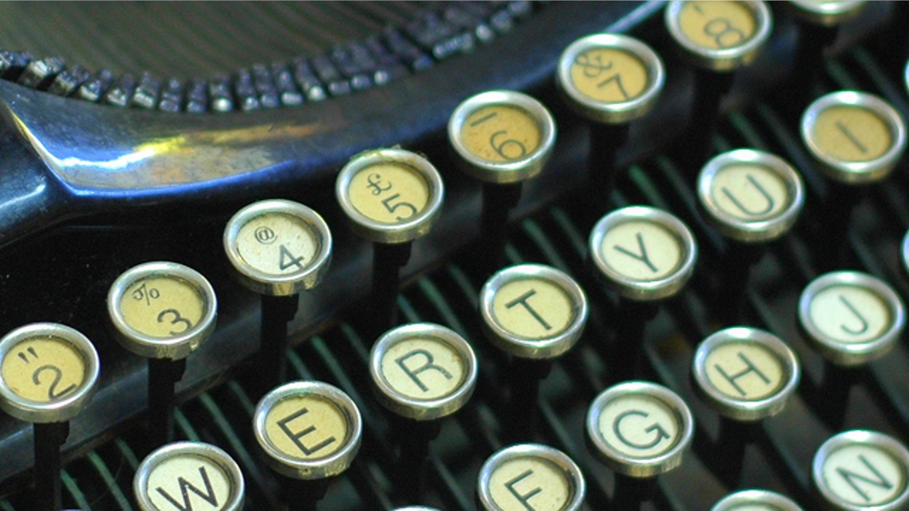 A close up photo of the keys on a vintage Underwood portable typewriter.