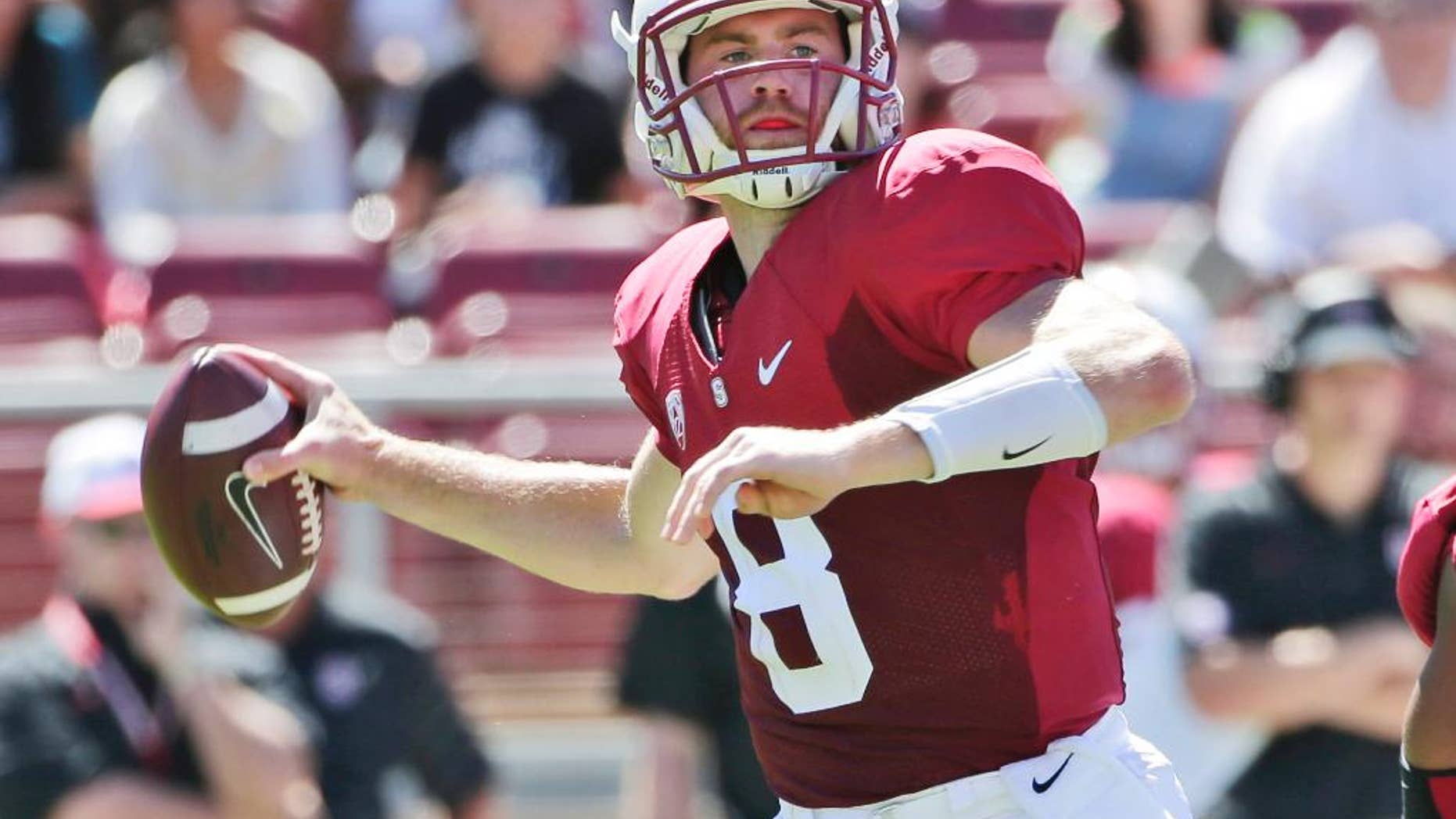 Stanford quarterback Kevin Hogan throws against UC Davis during the first half of an NCAA college football game on Saturday, Aug. 30, 2014, in Stanford, Calif. (AP Photo/Marcio Jose Sanchez)