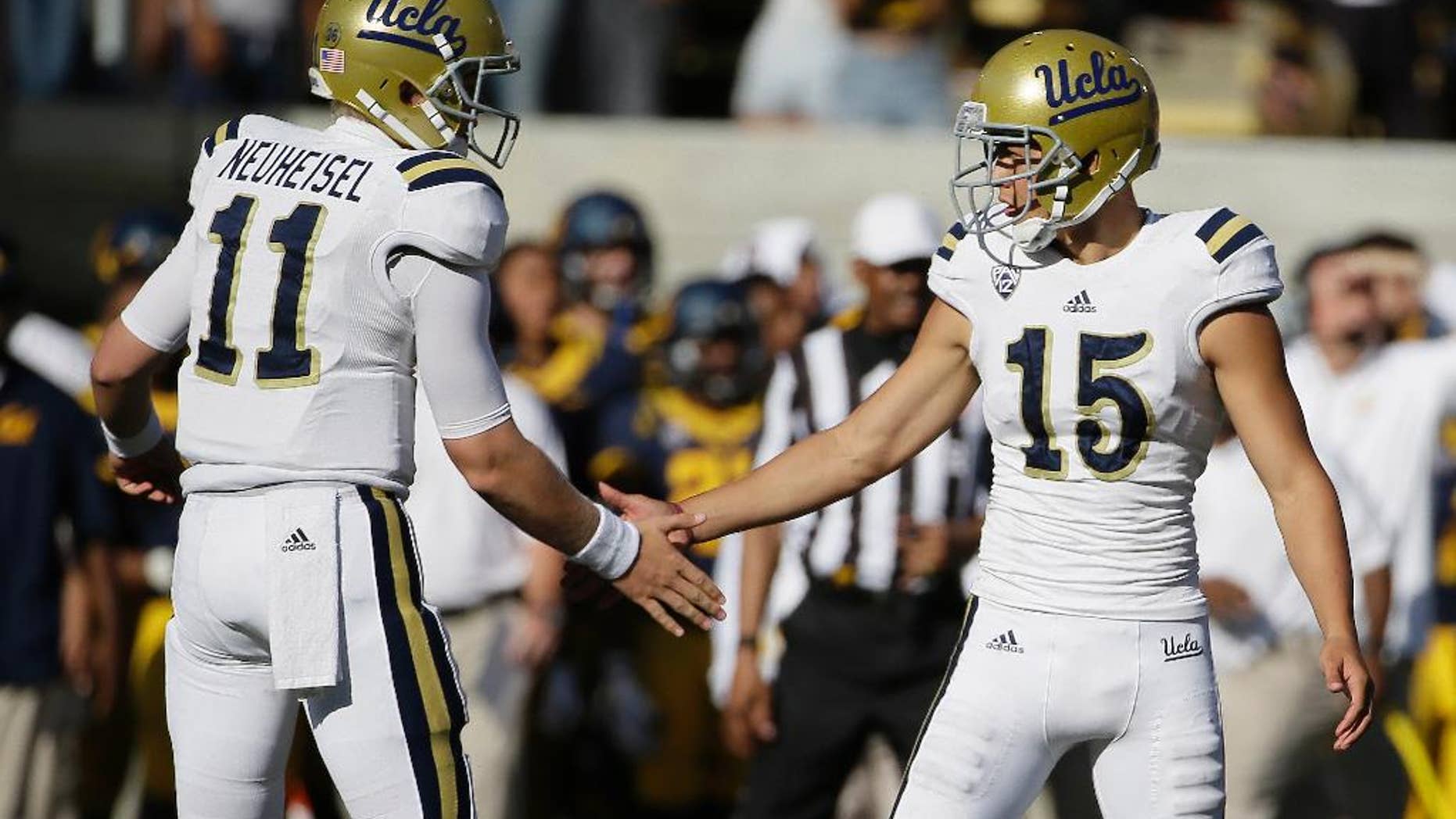 UCLA place kicker Ka'imi Fairbairn, right is greeted by holder Jerry Neuheisel, left, after kicking his third field goal of the game during the fourth quarter of a NCAA college football game against California Saturday, Oct. 18, 2014, in Berkeley, Calif. UCLA won the game 36-34. (AP Photo/Eric Risberg)