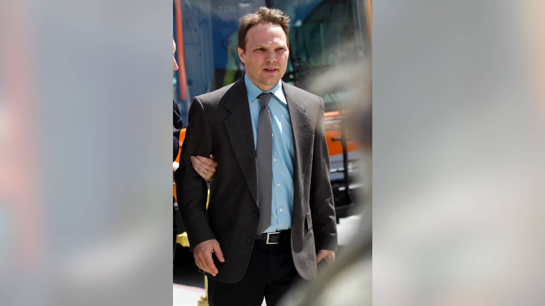 FILE - In this on April 11, 2012 file photo, University of California, Los Angeles, UCLA organic chemistry professor, Patrick Harran, walks out of Los Angeles Superior Criminal Courts building in Los Angeles. The criminal prosecution of Harran stemming from a fatal lab fire has ended with a settlement on Friday, June 20, 2014. The deal calls for professor Patrick Harran to prepare inner-city high school students for college chemistry for five years, perform 800 hours of community service and pay a $10,000 fine. The district attorney's office says Harran acknowledged in court Friday that he was the direct supervisor of the victim and was ultimately responsible for the safety of personnel.(AP Photo/Damian Dovarganes, File)