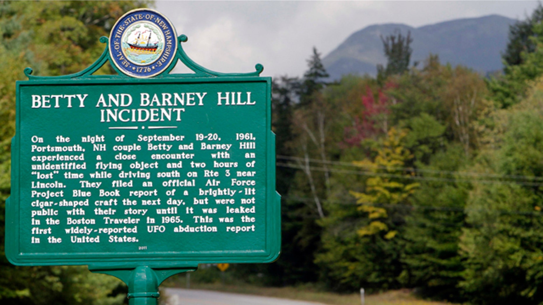 Sept. 14, 2011: A car passes through Franconia Notch where a state marker commemorates the fiftieth anniversary of a UFO sighting. In 1961, Betty and Barney Hill recalled seeing a large, flying disc-shaped object, and eventually said through hypnosis that they were abducted by extraterrestrials.