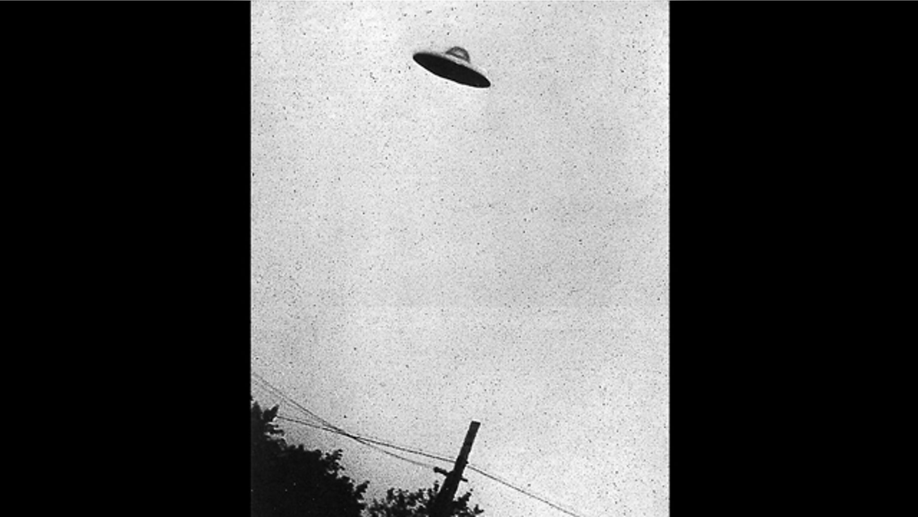 This grainy black and white image purports to show a UFO hovering over Passoria, New Jersey, in July, 1952.