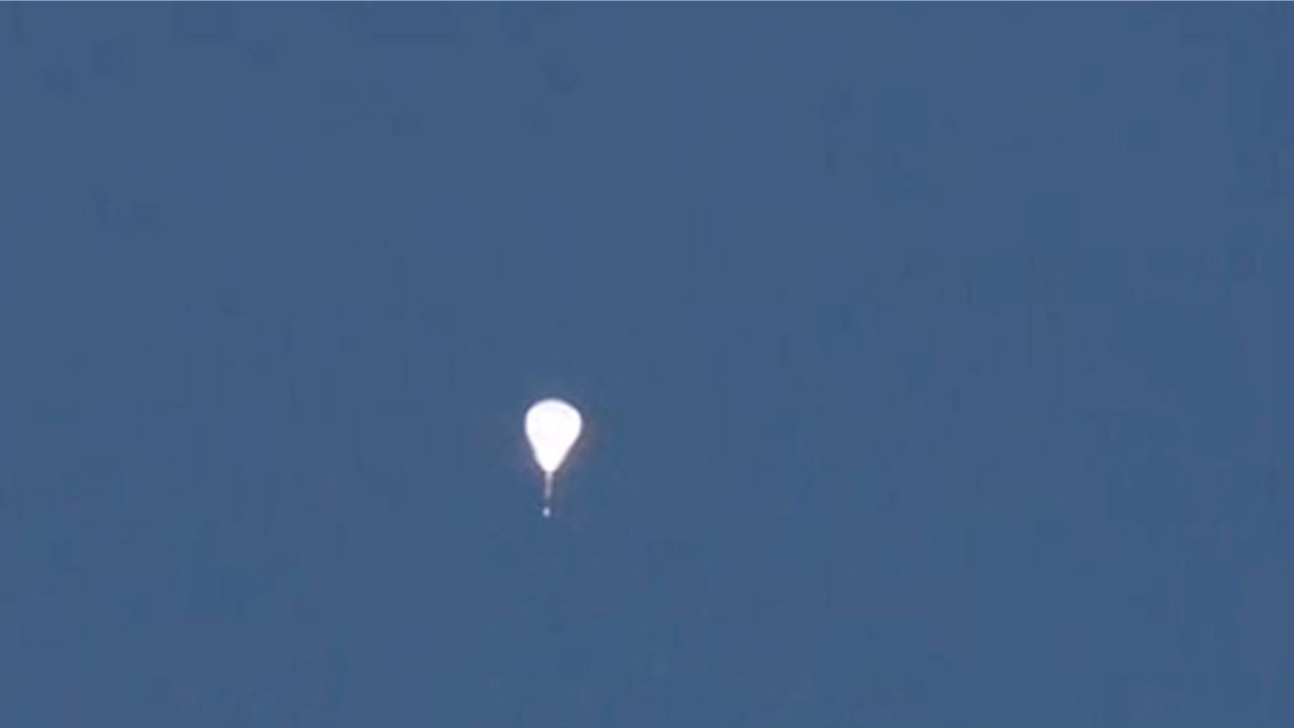 This mysterious, glowing teardrop-shaped object was seen high in the sky above Phoenix.
