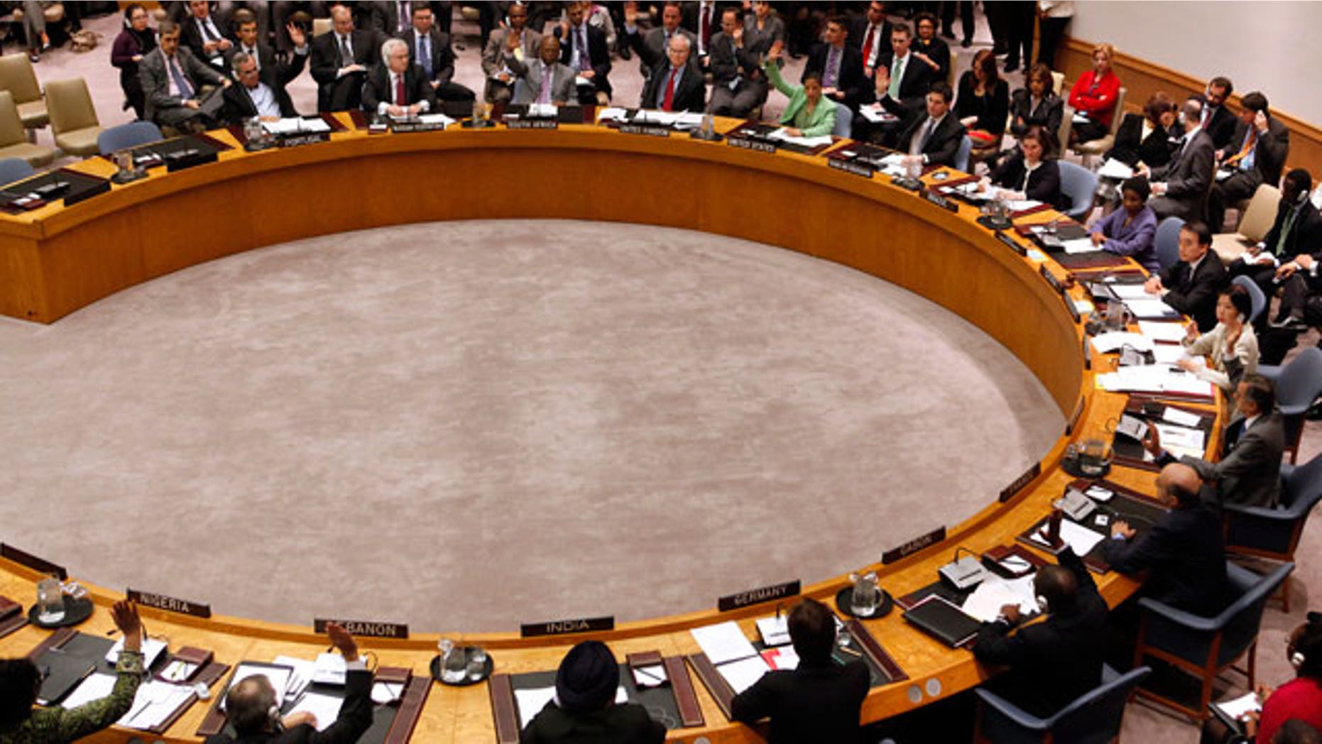 Member states vote to approve a resolution that will impose a no-fly zone over Libya during a meeting of the United Nations Security Council at UN headquarters Thursday, March 17, 2011. (AP)