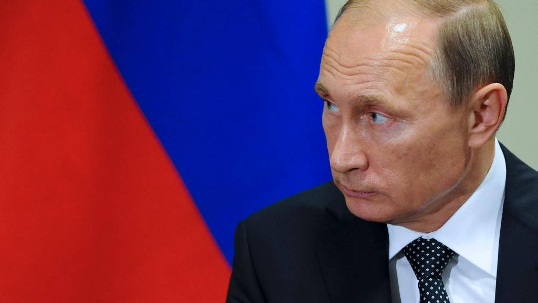 Russian President President Vladimir Putin listens to United Nations Secretary-General Ban Ki-moon after the 70th session of the United Nations General Assembly at U.N. headquarters, New York, Monday, Sept. 28, 2015. (Mikhail Klimentyev, RIA-Novosti, Kremlin Pool Photo via AP)