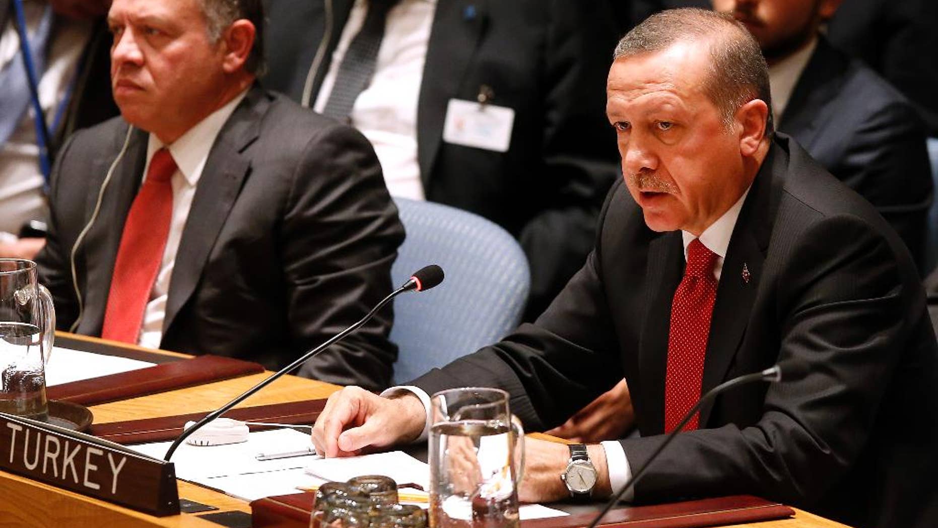President Recep Tayyib Erdogan of Turkey addresses a meeting of the United Nations Security Council regarding the threat of foreign terrorist fighters during the 69th session of the U.N. General Assembly at U.N. headquarters, Wednesday, Sept. 24, 2014. (AP Photo/Jason DeCrow)