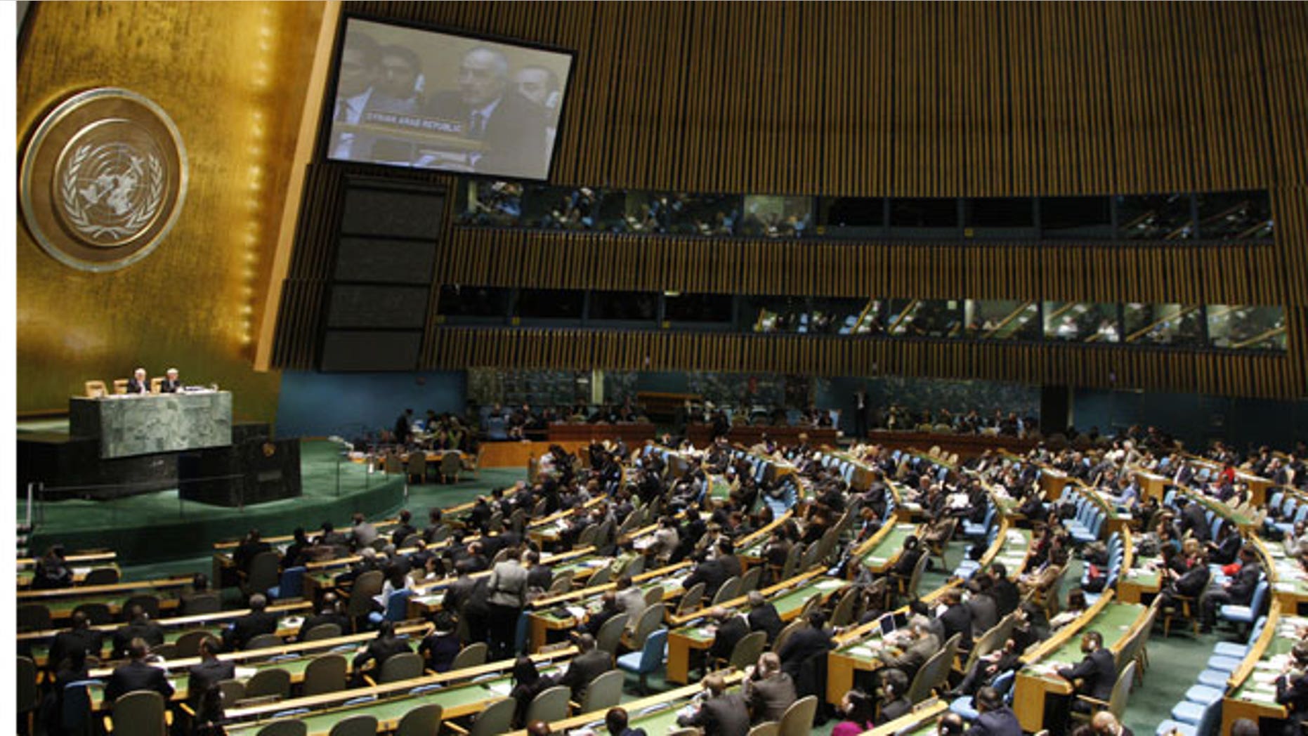 Feb. 16, 2012: In this photo provided by the United Nations, Syrian Ambassador to the United Nations Bashar Ja'afari can be seen on the monitor as he addresses the U. N. General Assembly.