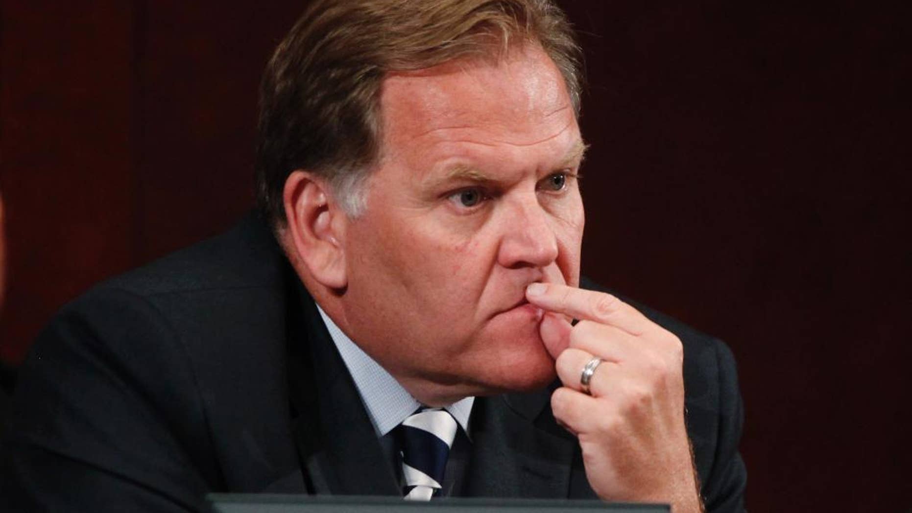 FILE - In this June 18, 2013, file photo, House Intelligence Committee Chairman Rep. Mike Rogers, R-Mich. listens to testimony on Capitol Hill in Washington, by National Security Agency Gen. Keith B. Alexander. Al-Qaida’s Afghanistan leader is laying the groundwork to relaunch his war-shattered organization once the United States and international forces withdraw from the country, as they have warned they will do without a security agreement from the Afghan government, U.S. officials say. (AP Photo/Charles Dharapak, File)