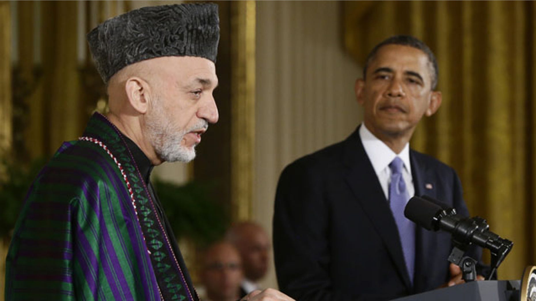FILE - This Jan. 11, 2013 file photo shows President Barack Obama listening as Afghan President Hamid Karzai speaks during a news conference in the East Room at the White House in Washington. (AP)