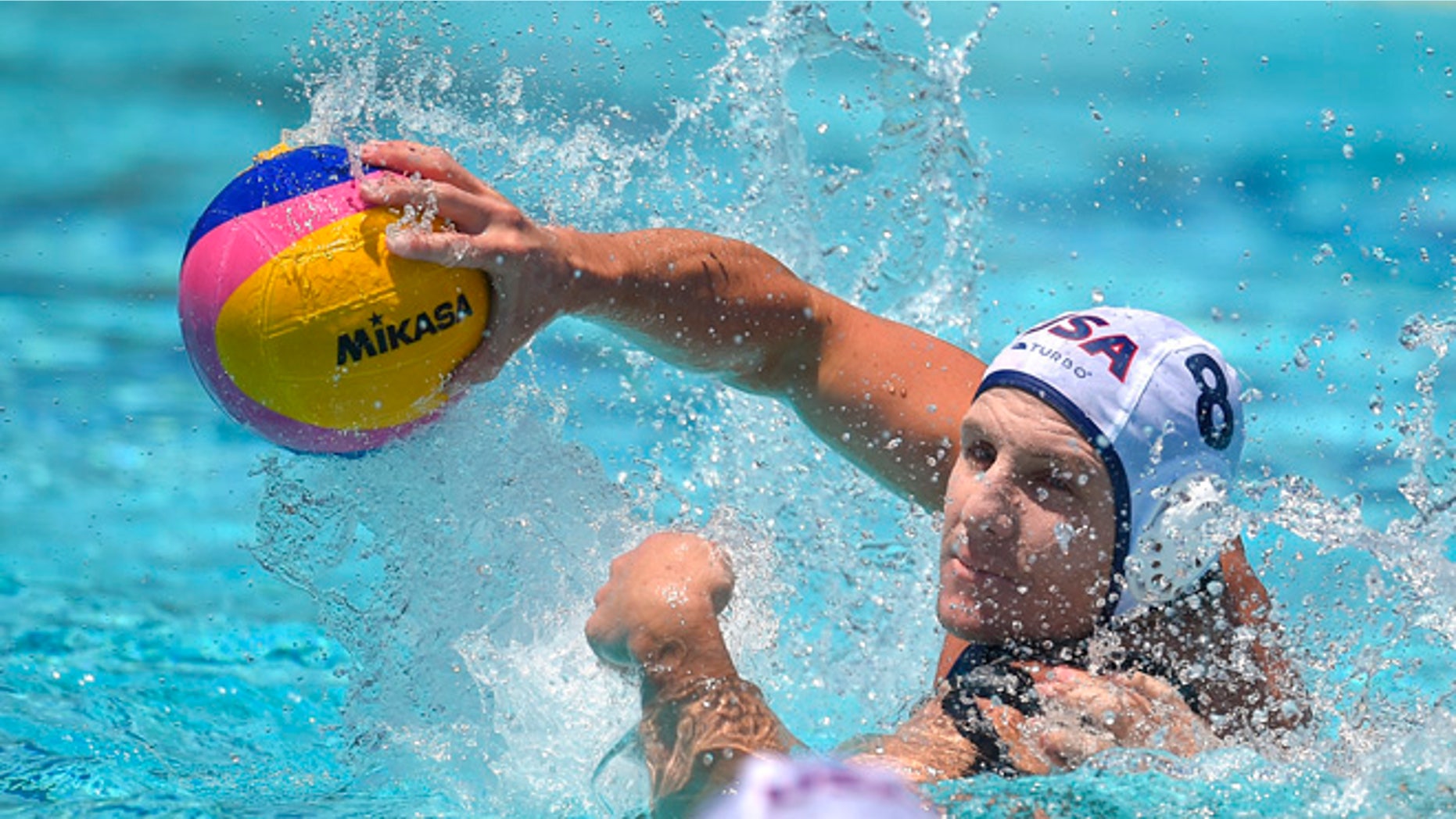 United States attacker Tony Azevedo passes the ball during a men's exhibition water polo match against Australia, Sunday, May 22, 2016, in Los Angeles. (AP Photo/Mark J. Terrill)