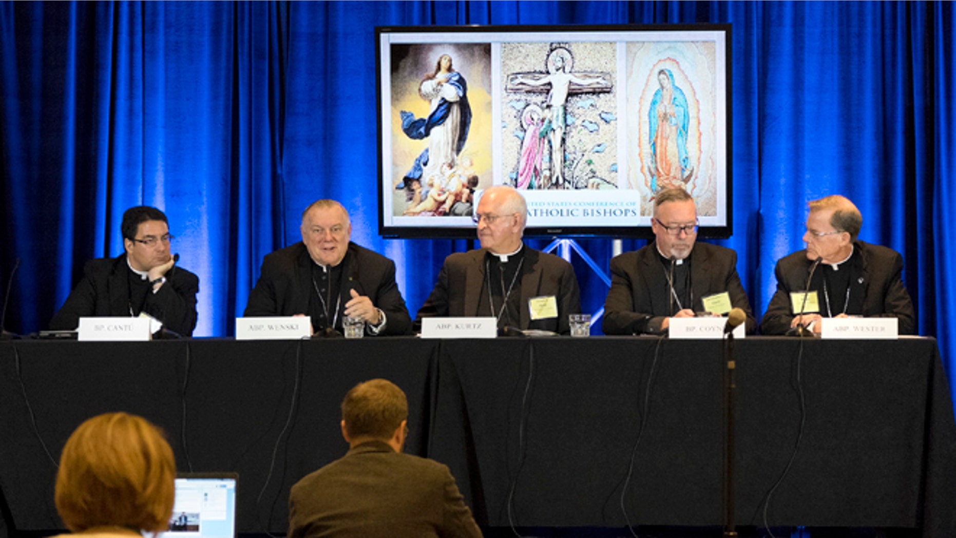Bishop Oscar Cantú, left, of Las Cruses, Archbishop Thomas Wenski, of Miami, Archbishop Joseph Kurtz, of Louisville and president of the U.S. Conference of Catholic Bishops, Bishop Christopher Coyne, of Burlington and Archbishop John Wester, of Santa Fe, participate in a news conference during the U.S. Conference of Catholic Bishops' Spring General Assembly in St. Louis Wednesday, June 10, 2015. Roman Catholic bishops are condemning racism in the U.S. in light of national tensions over police treatment of African-Americans. (AP Photo/Sid Hastings)