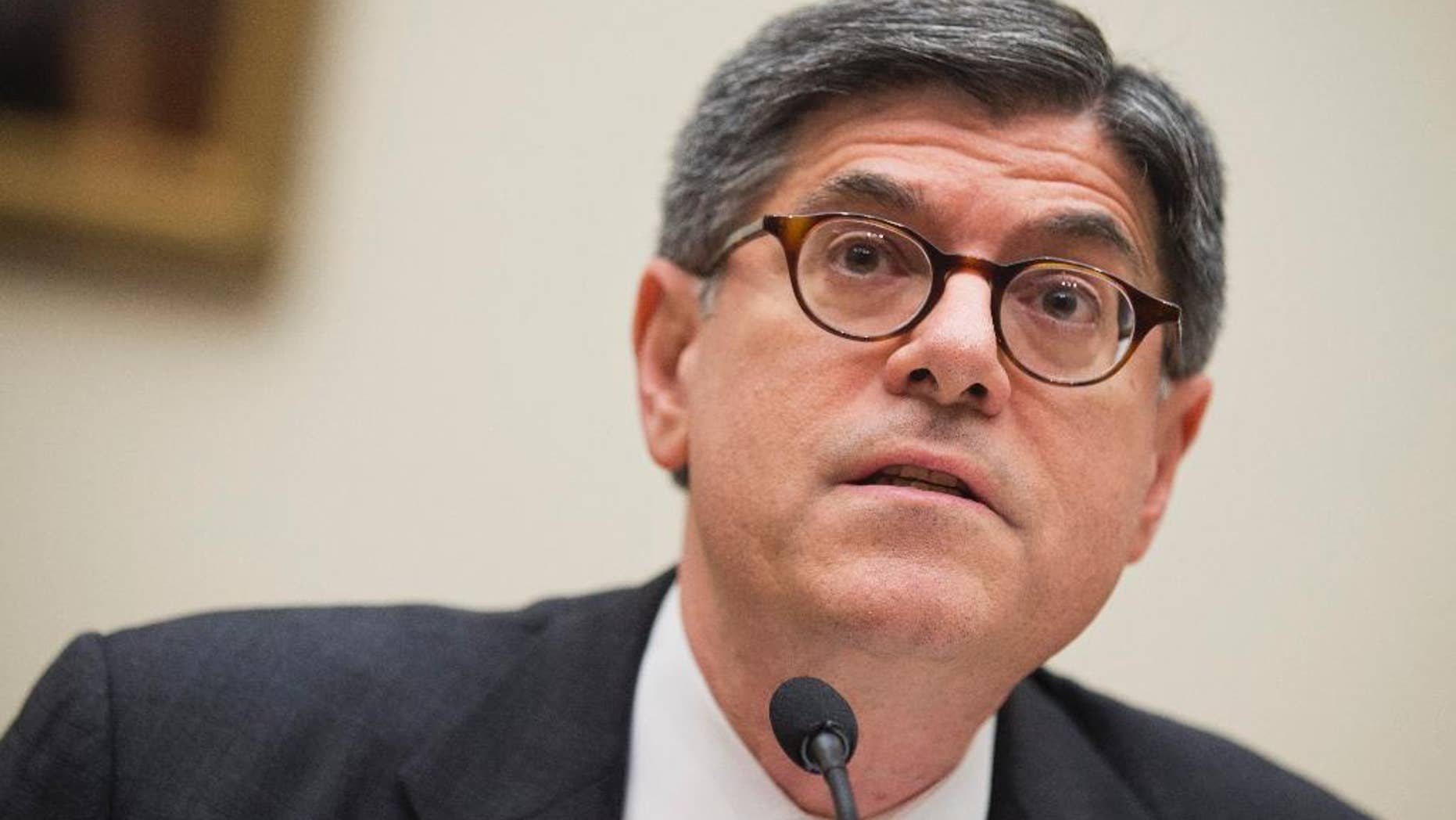 FILE - In this May 8, 2014 file photo, U.S. Treasury Secretary Jacob Lew, testifies before a House Financial Committee hearing on "the annual testimony of the Secretary of the Treasury on the state of the international financial system," on Capitol Hill in Washington. Lew pressed China on Tuesday, May 13, 2014, to ease politically sensitive exchange rate controls and lower barriers to foreign investment. Beijing in March widened the narrow band in which it allows its yuan to fluctuate against the U.S. dollar. But it retained controls that critics complain keep the yuan undervalued and give its exporters an unfair price advantage. (AP Photo/Manuel Balce Ceneta, File)