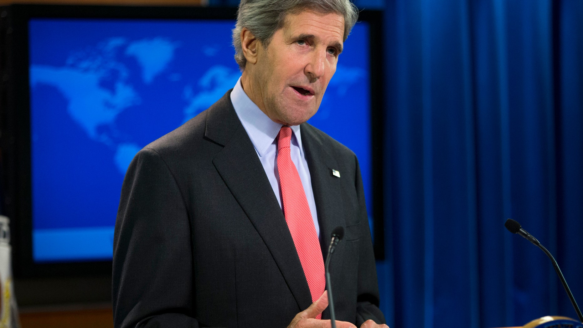 Secretary of State John Kerry gestures during a statement on the ongoing situation in Egypt before the start of a press briefing at the State Department in Washington, Wednesday, Aug. 14, 2013. Kerry said the violence in Egypt is deplorable and is a serious blow to reconciliation efforts. He says it runs counter to Egyptians' aspirations for peace. (AP Photo/Evan Vucci)