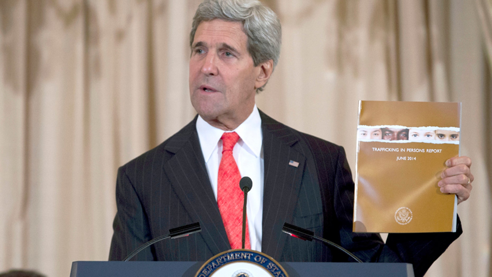 Secretary of State John Kerry speaks during the release of the 2014 Trafficking in Persons Report, Friday, June 20, 2014, at the State Department in Washington.