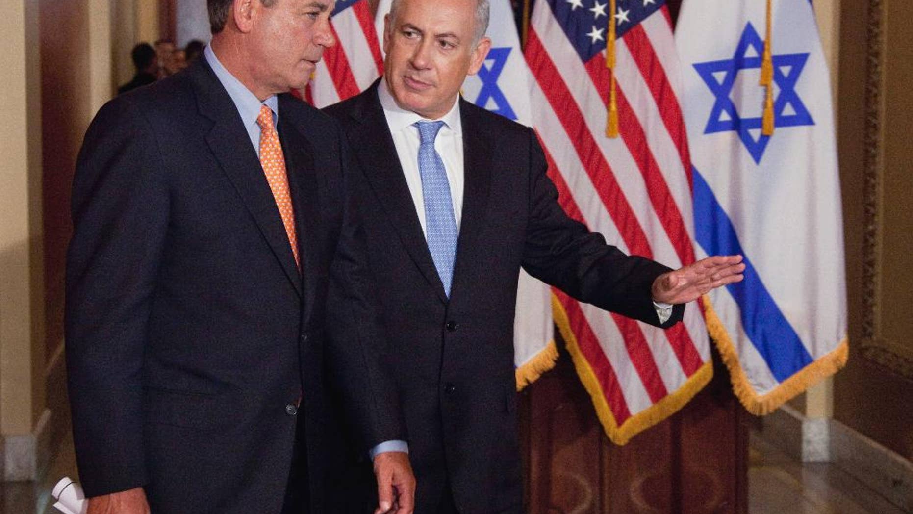 FILE - In this May 24, 2011 file photo, Israeli Prime Minister Benjamin Netanyahu walks with House Speaker John Boehner of Ohio to make a statement on Capitol Hill in Washington. Boehner has invited Netanyahu to address Congress about Iran. (AP Photo/Evan Vucci, File)