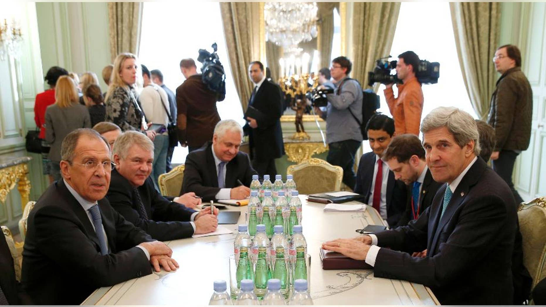 Secretary of State John Kerry and Russian Foreign Minister Sergei Lavrov meet at the Russian Ambassador's Residence in Paris, Wednesday, March 5, 2014. Russia rebuffed Western demands to withdraw forces in Ukraine's Crimea region to their bases on Wednesday amid a day of high-stakes diplomacy in Paris aimed at easing tensions over Ukraine and averting the risk of war. (AP Photo/Kevin Lamarque, Pool)