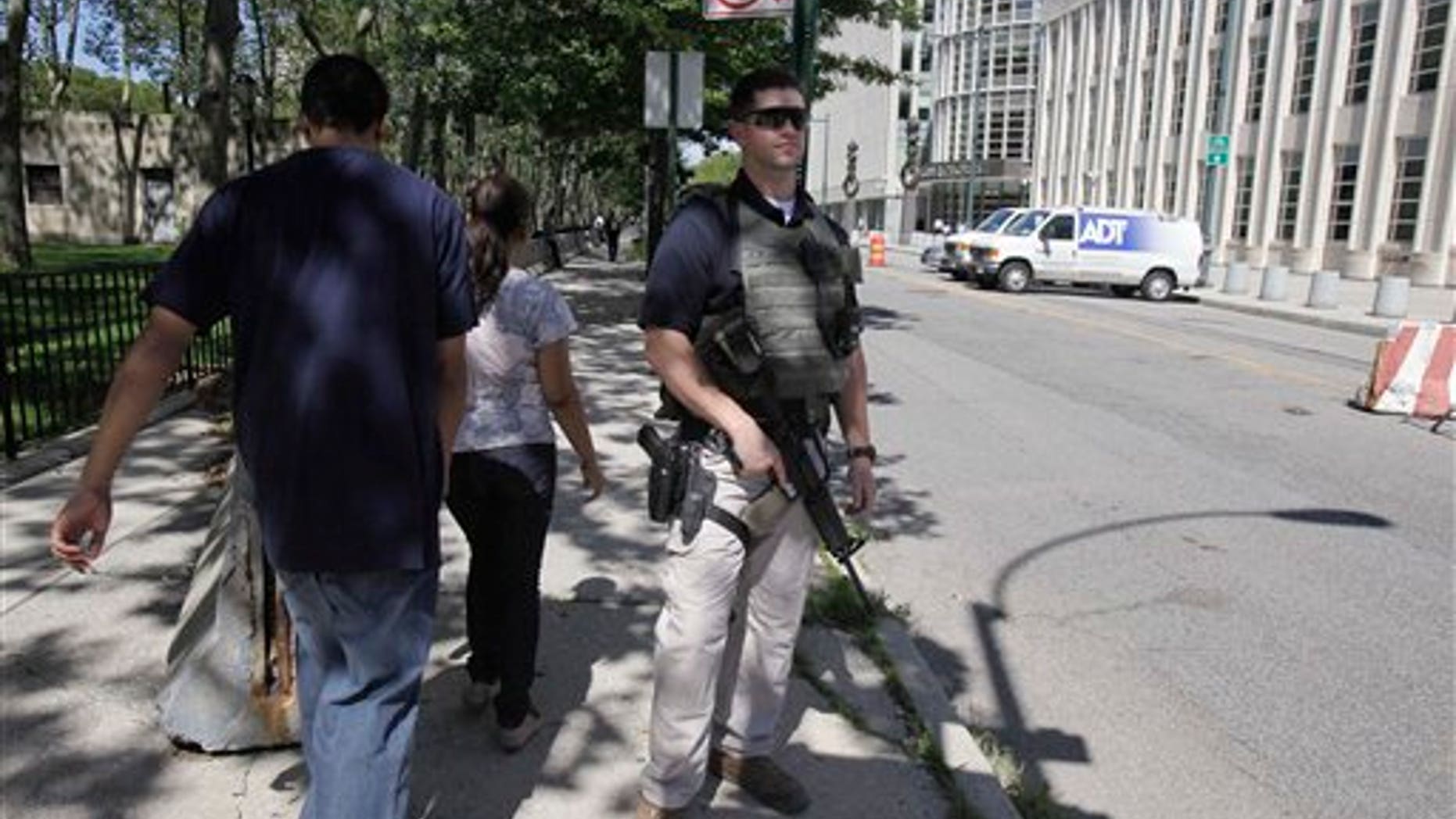Sept 9: An armed U.S. Marshal stands guard outside the Federal Courthouse in Brooklyn. New York City resident Agron Hasbajrami, in an indictment unsealed in Brooklyn, has been charged with providing material support to a terrorist organization by plotting to travel to Pakistan to join a radical fighting group.