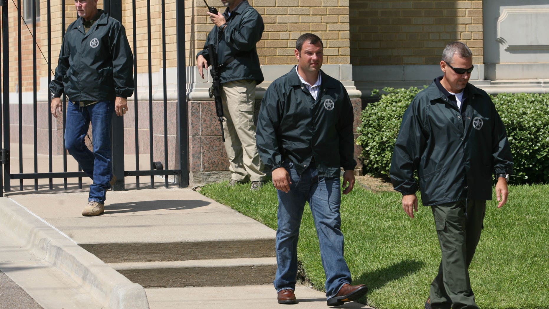 July 29, 2011: U.S. Marshals take position at a United States federal courthouse security gate during an appearance by AWOL soldier Pfc. Naser Abdo in Waco, Texas. Abdo is accused of plotting an attack on Fort Hood.