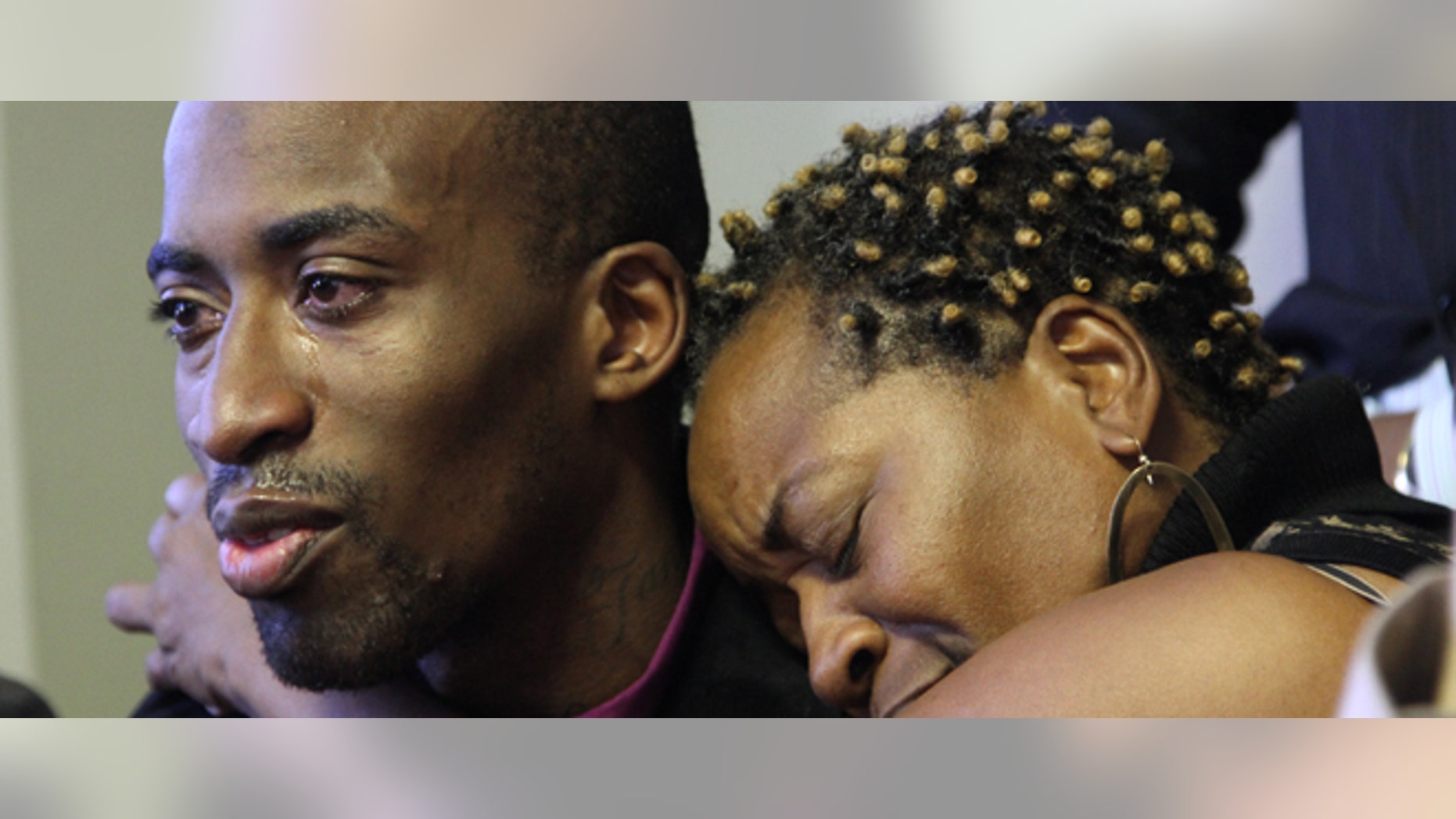 Jabin Bogan is hugged by his mother Aletha Smith as they participate in a news conference on Friday, Nov. 23, 2012 in El Paso, Texas. The 27-year-old Dallas truck driver was released after seven months in a prison in Mexico accused of ammunition smuggling. He was arrested in April after crossing the border by mistake with 268,000 rounds of ammunition. (AP Photo/Juan Carlos Llorca)