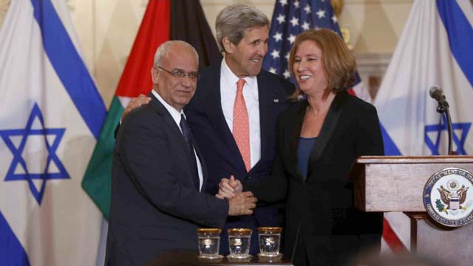 July 30, 2013: Secretary of State John Kerry stands with Israel's Justice Minister and chief negotiator Tzipi Livni, right, and Palestinian chief negotiator Saeb Erekat, after the resumption of Israeli-Palestinian peace talks at the State Department in Washington. (AP Photo)