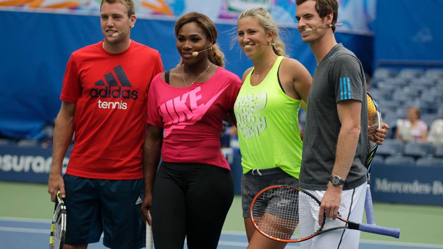 Tennis players, from left, Jack Sock, Serena Williams, Victoria Azarenka and Andy Murray appear at U.S. Open Arthur Ashe Kids Day at the USTA Billie Jean King National Tennis Center on Saturday, Aug. 23, 2014, in New York. (Photo by Andy Kropa/Invision/AP)