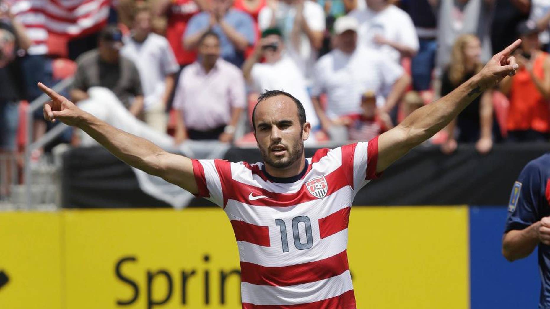 FILE - In this July 13, 2013, file photo, United States' Landon Donovan gestures after scoring on a penalty kick during the first half of a CONCACAF Gold Cup soccer game against Cuba in Sandy, Utah. Donovan will be surrounded by a relatively youthful roster for the United States' exhibition against Ecuador in Connecticut on Friday, when he is set to make his 157th and final international appearance. (AP Photo/Rick Bowmer, File)
