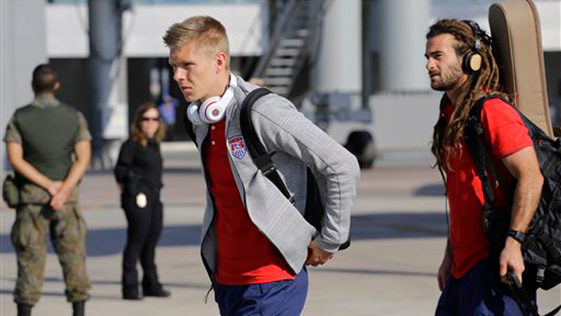 United States' national soccer team players Aron Johannsson, left, and Kyle Beckerman arrives at the Sao Paulo International airport in Brazil, Monday, June 9, 2014. The U.S. team arrived in Sao Paulo to continue their preparations for the upcoming Brazil 2014 World Cup, which starts on June 12. (AP Photo/Nelson Antoine)