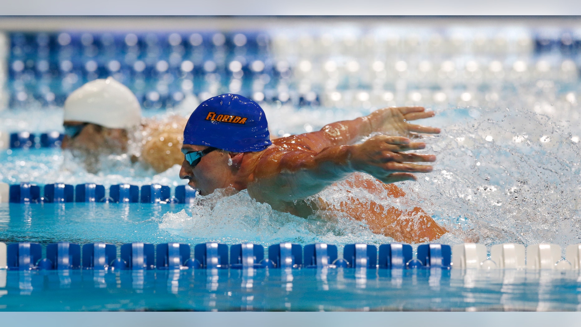 June 25, 2012: Ryan Lochte, right, and Michael Phelps compete in the men's 400-meter individual medley final at the U.S. Olympic swimming trials in Omaha, Neb.